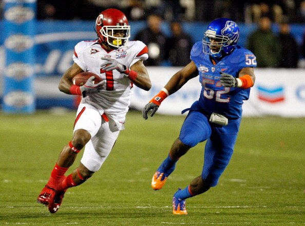 LAS VEGAS, NV - DECEMBER 22:  Shaky Smithson #1 of the Utah Utes runs for yardage against Derrell Acrey #52 of the Boise State Broncos during the MAACO Bowl Las Vegas at Sam Boyd Stadium December 22, 2010 in Las Vegas, Nevada. Boise State Won 26-3.  (Phot