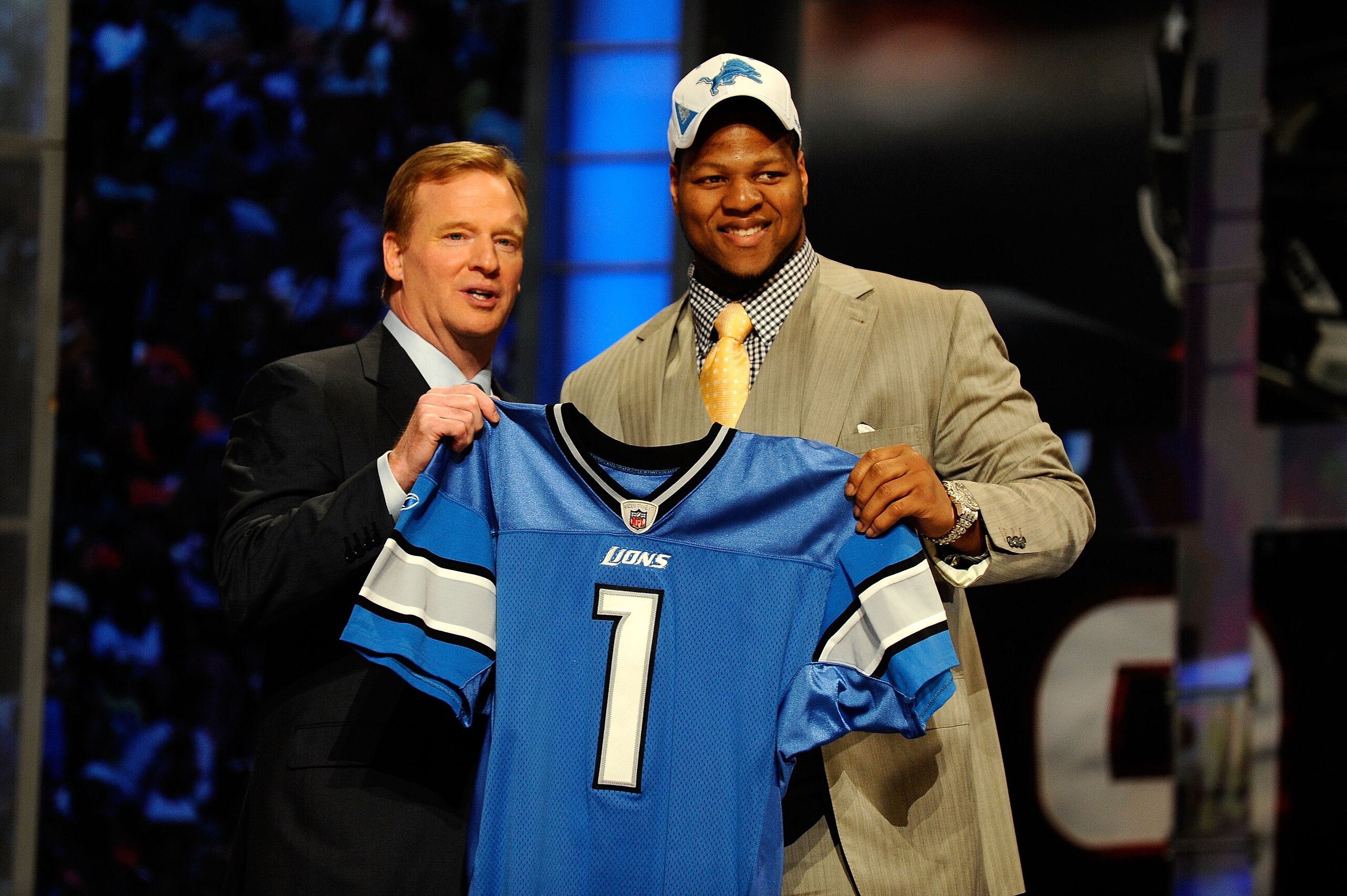 NEW YORK - APRIL 22: Ndamukong Suh of the Nebraska Cornhuskers stands with NFL Commissioner Roger Goodell as he holds up a Detroit Lions Jersey after Suh was picked #2 overall by the Lions during the 2010 NFL Draft at Radio City Music Hall on April 22, 2 NEW YORK - APRIL 22: Ndamukong Suh of the Nebraska Cornhuskers stands with NFL Commissioner Roger Goodell as he holds up a Detroit Lions Jersey after Suh was picked #2 overall by the Lions during the 2010 NFL Draft at Radio City Music Hall on April 22, 2