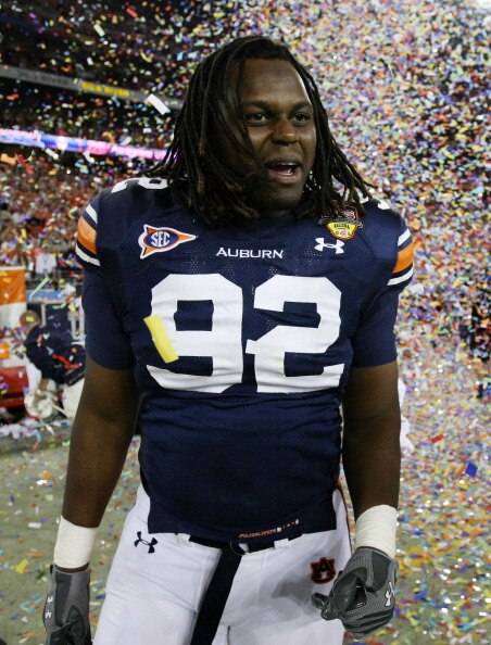 GLENDALE, AZ - JANUARY 10:  Kenneth Carter #92 of the Auburn Tigers celebrates the Tigers 22-19 victory against the Oregon Ducks in the Tostitos BCS National Championship Game at University of Phoenix Stadium on January 10, 2011 in Glendale, Arizona.  (Ph