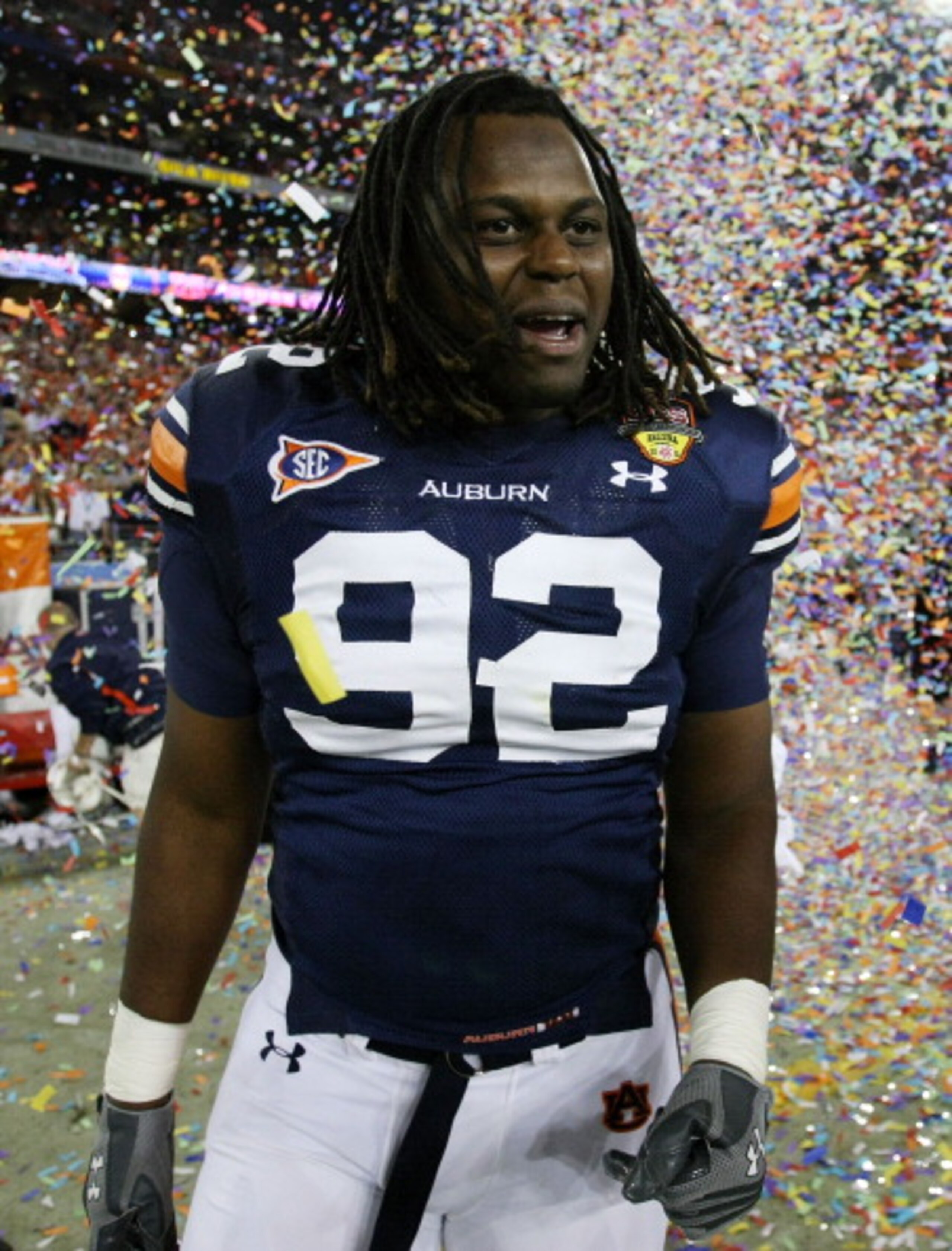 GLENDALE, AZ - JANUARY 10:  Kenneth Carter #92 of the Auburn Tigers celebrates the Tigers 22-19 victory against the Oregon Ducks in the Tostitos BCS National Championship Game at University of Phoenix Stadium on January 10, 2011 in Glendale, Arizona.  (Ph