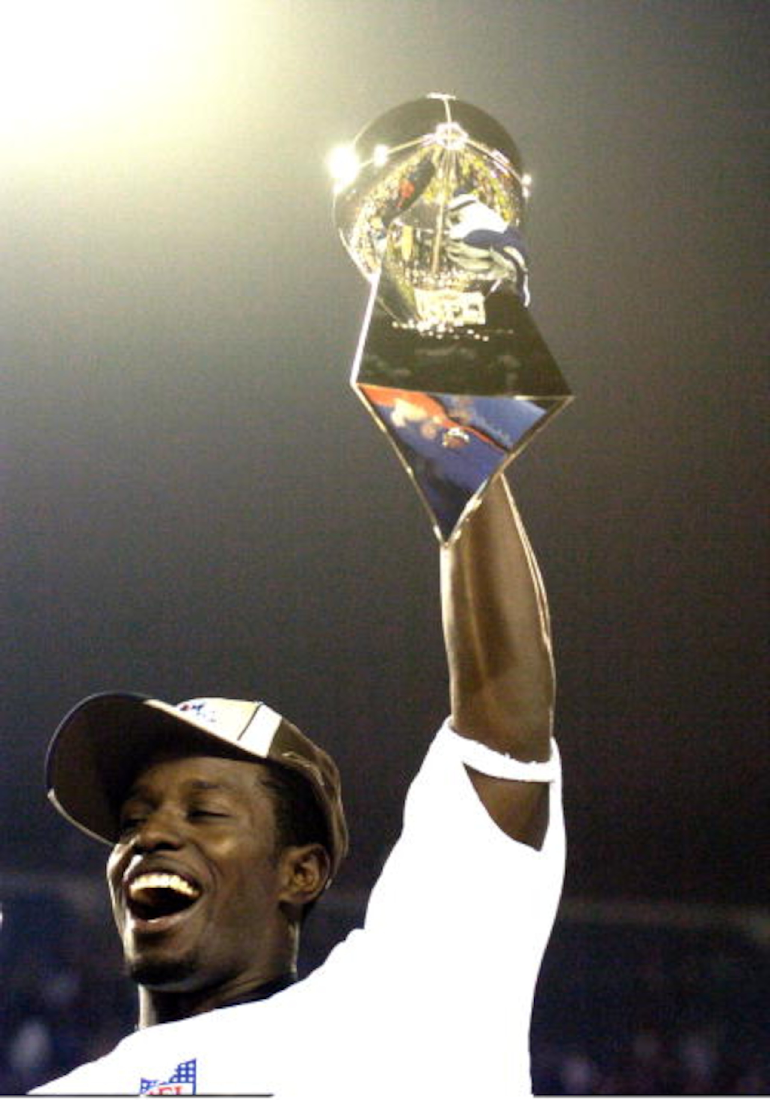 Super Bowl XXXIX Most Valuable Player Deion Branch holds up The Vince Lombardi Trophy  The New England Patriots defeated The Philadelphia Eagles in Super Bowl XXXIX at Alltel Staduim in Jacksonville, Florida.  (Photo by Al Messerschmidt/Getty Images)