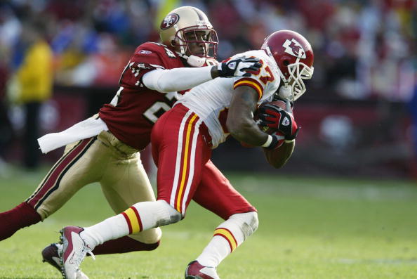 SAN FRANCISCO - NOVEMBER 10:  Wide Receiver Eddie Kennison #87 of the Kansas City Chiefs moves the ball during the NFL game against Cornerback Mike Rumph #24 of the San Francisco 49ers at 3Com Park on November 10, 2002 in San Francisco, California. The 49