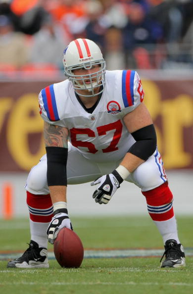 DENVER - OCTOBER 11:  Center Dan Koppen #67 of the New England Patriots prepares to snap the ball against the Denver Broncos during NFL action at Invesco Field at Mile High on October 11, 2009 in Denver, Colorado. The Broncos defeated the Patriots 20-17 i