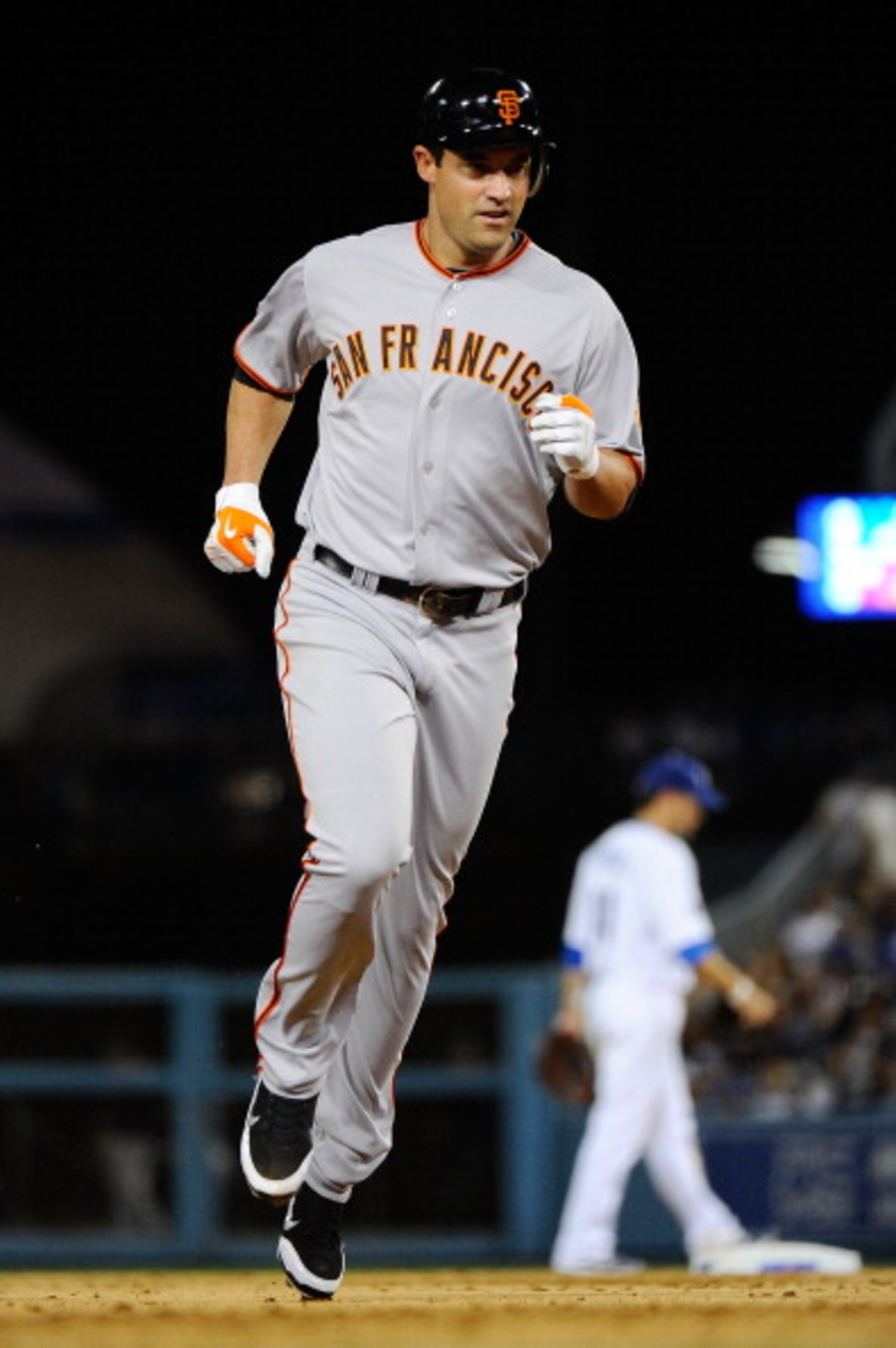 LOS ANGELES, CA - MARCH 31:  Pat Burrell #5 of the San Francisco Giants runs the bases after hitting a home run in the ninth inning against the Los Angeles Dodgers on Opening Day at Dodger Stadium on March 31, 2011 in Los Angeles, California.  (Photo by K