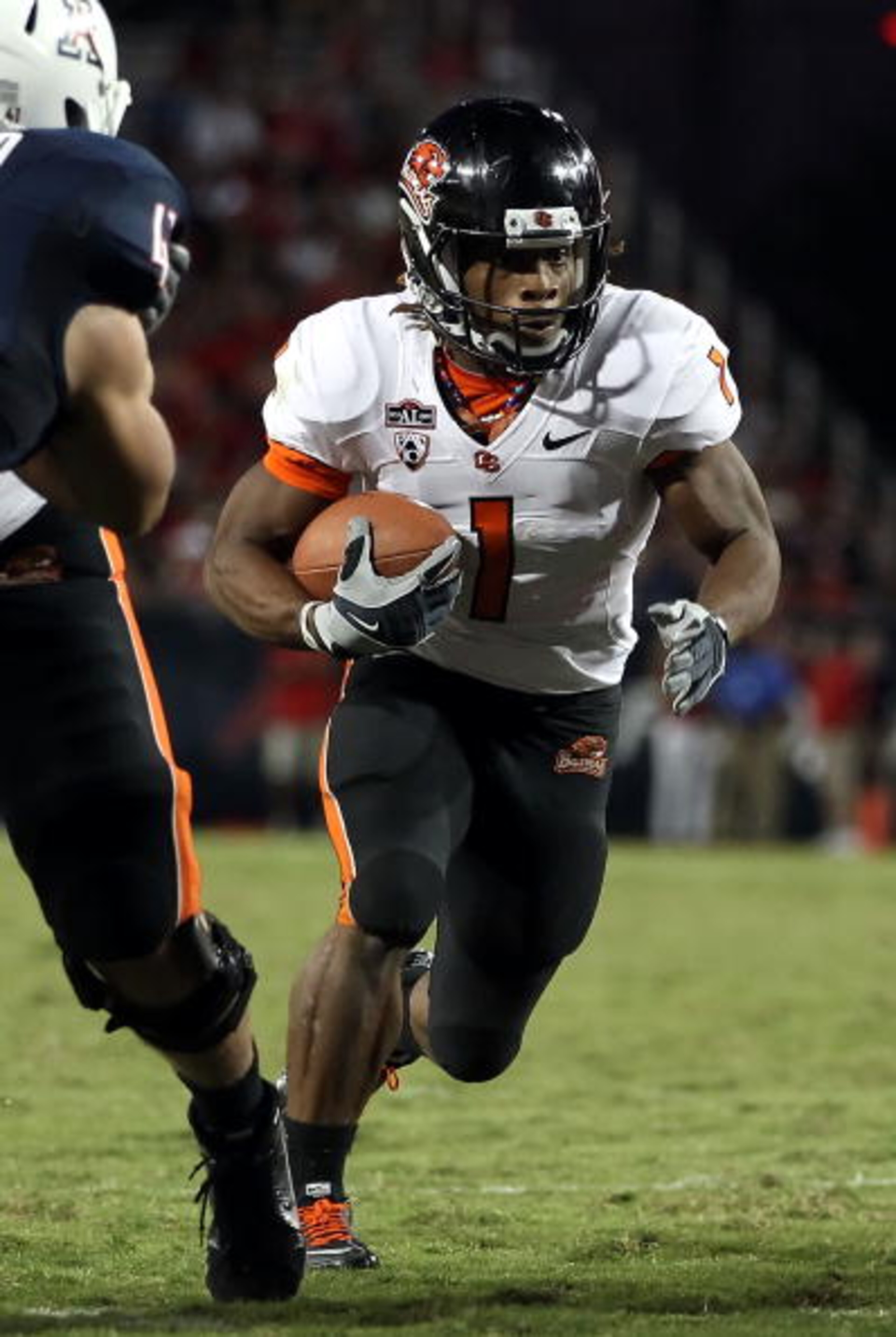 TUCSON, AZ - OCTOBER 09: Runningback Jacquizz Rodgers #1 of the Oregon State Beavers runs with the football during the college football game against the Arizona Wildcats at Arizona Stadium on October 9, 2010 in Tucson, Arizona. The Beavers defeated the W TUCSON, AZ - OCTOBER 09: Runningback Jacquizz Rodgers #1 of the Oregon State Beavers runs with the football during the college football game against the Arizona Wildcats at Arizona Stadium on October 9, 2010 in Tucson, Arizona. The Beavers defeated the W