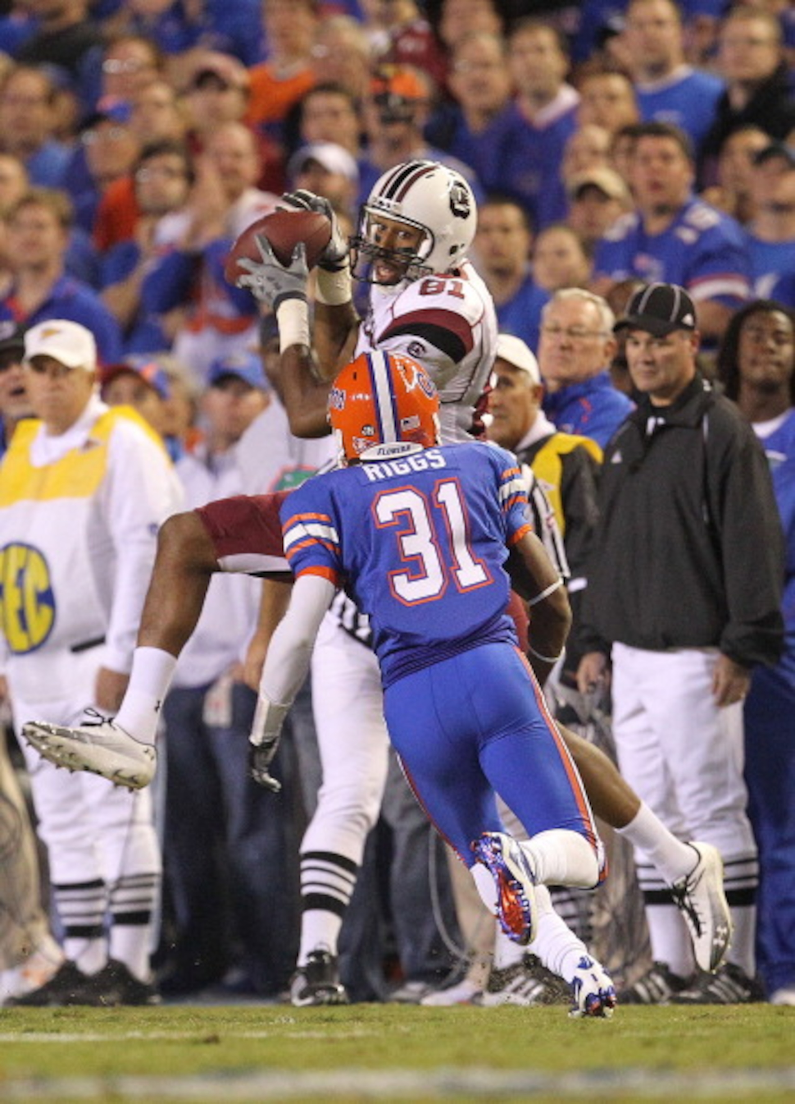 GAINESVILLE, FL - NOVEMBER 13:  Tori Gurley #81 of the South Carolina Gamecocks makes a catch against Cody Riggs #31 of the Florida Gators during a game at Ben Hill Griffin Stadium on November 13, 2010 in Gainesville, Florida. The Gamecocks beat the Gator