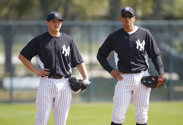 TAMPA, FL - FEBRUARY 20:  Brandon Laird #75 and Alex Rodriguez #13 of the New York Yankees watch the action during the first full team workout of Spring Training on February 20, 2011 at the George M. Steinbrenner Field in Tampa, Florida.  (Photo by Leon H
