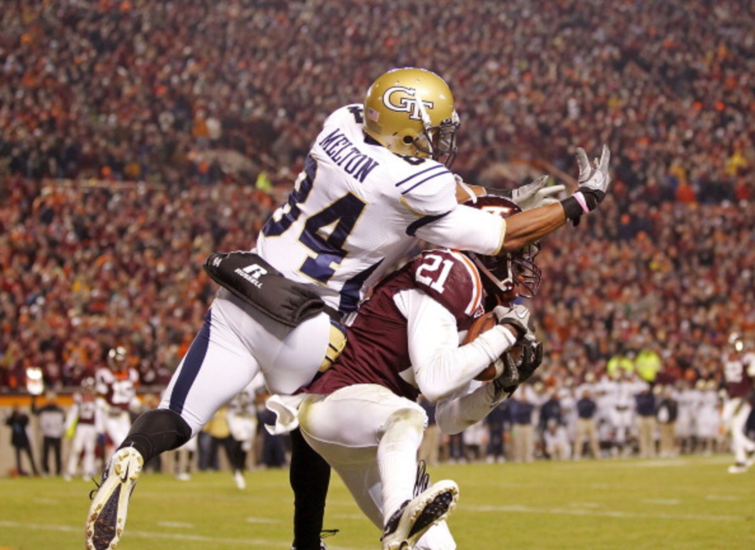 BLACKSBURG, VA - NOVEMBER 04: Cornerback Rashad Carmichael #21 of the Virginia Tech Hokies intercepts a pass in the end zone in the final seconds intended for wide receiver Tyler Melton #84 of the Georgia Tech Yellow Jackets at Lane Stadium on November 4 BLACKSBURG, VA - NOVEMBER 04: Cornerback Rashad Carmichael #21 of the Virginia Tech Hokies intercepts a pass in the end zone in the final seconds intended for wide receiver Tyler Melton #84 of the Georgia Tech Yellow Jackets at Lane Stadium on November 4