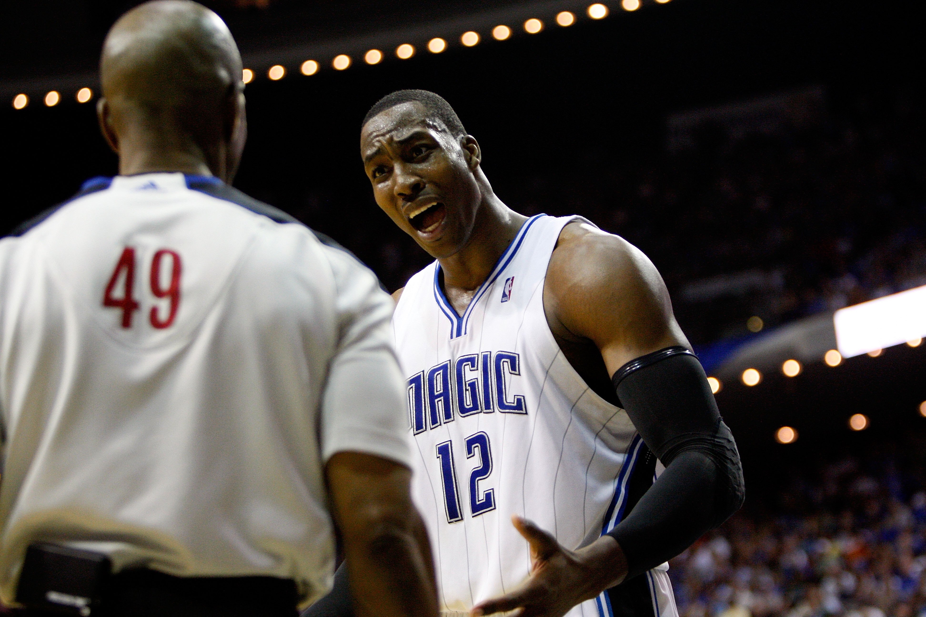 ORLANDO, FL - MAY 26:  Dwight Howard #12 of the Orlando Magic talks with referee Tom Washington against the Boston Celtics in Game Five of the Eastern Conference Finals during the 2010 NBA Playoffs at Amway Arena on May 26, 2010 in Orlando, Florida.  NOTE