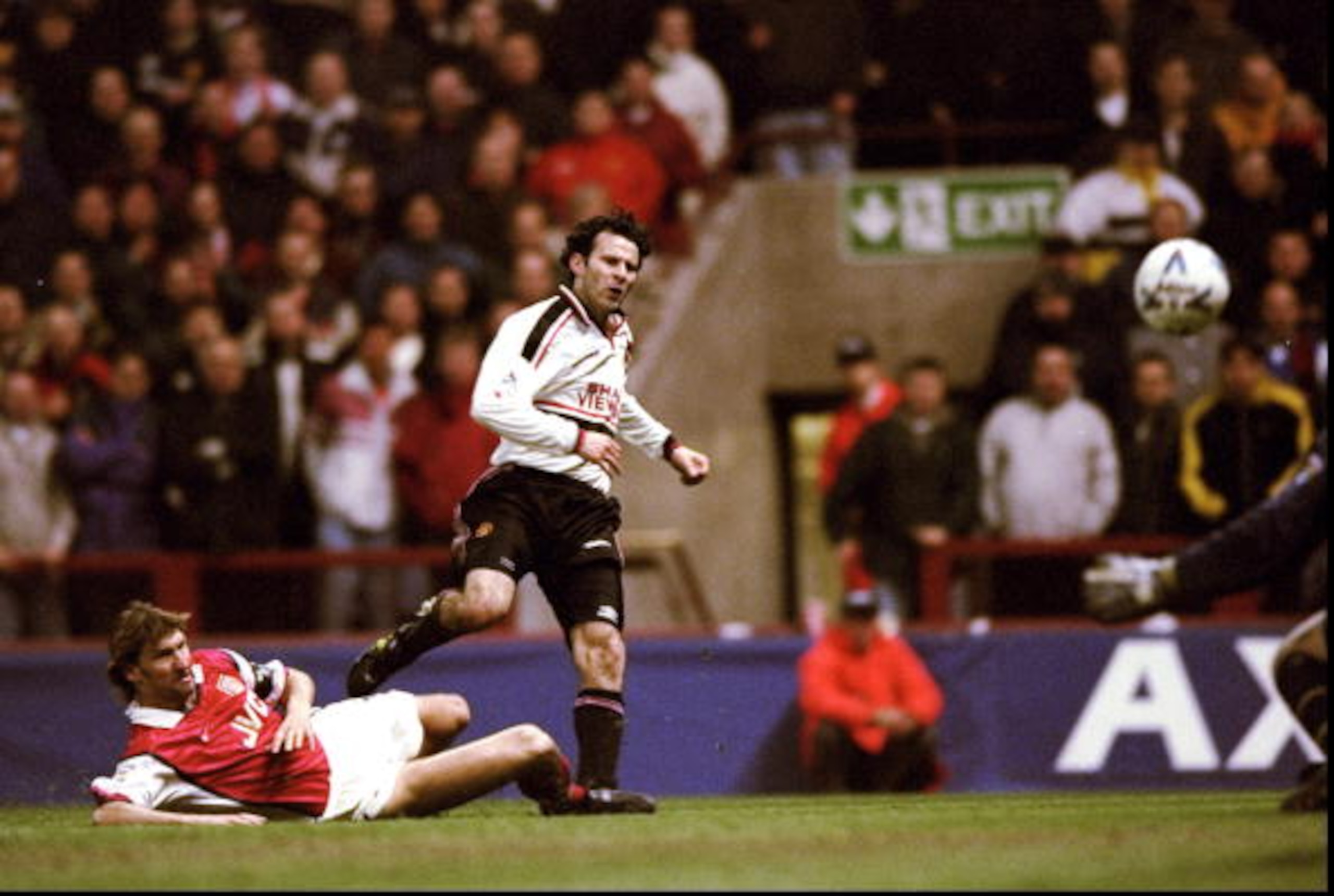 14 Apr 1999: Ryan Giggs of Manchester United beats the despairing lunge of Tony Adams of Arsenal to drive the ball past David Seaman to score the winner in the FA Cup Semi Final match played at Villa Park in Birmingham. Manchester United won the game 2-1 14 Apr 1999: Ryan Giggs of Manchester United beats the despairing lunge of Tony Adams of Arsenal to drive the ball past David Seaman to score the winner in the FA Cup Semi Final match played at Villa Park in Birmingham. Manchester United won the game 2-1