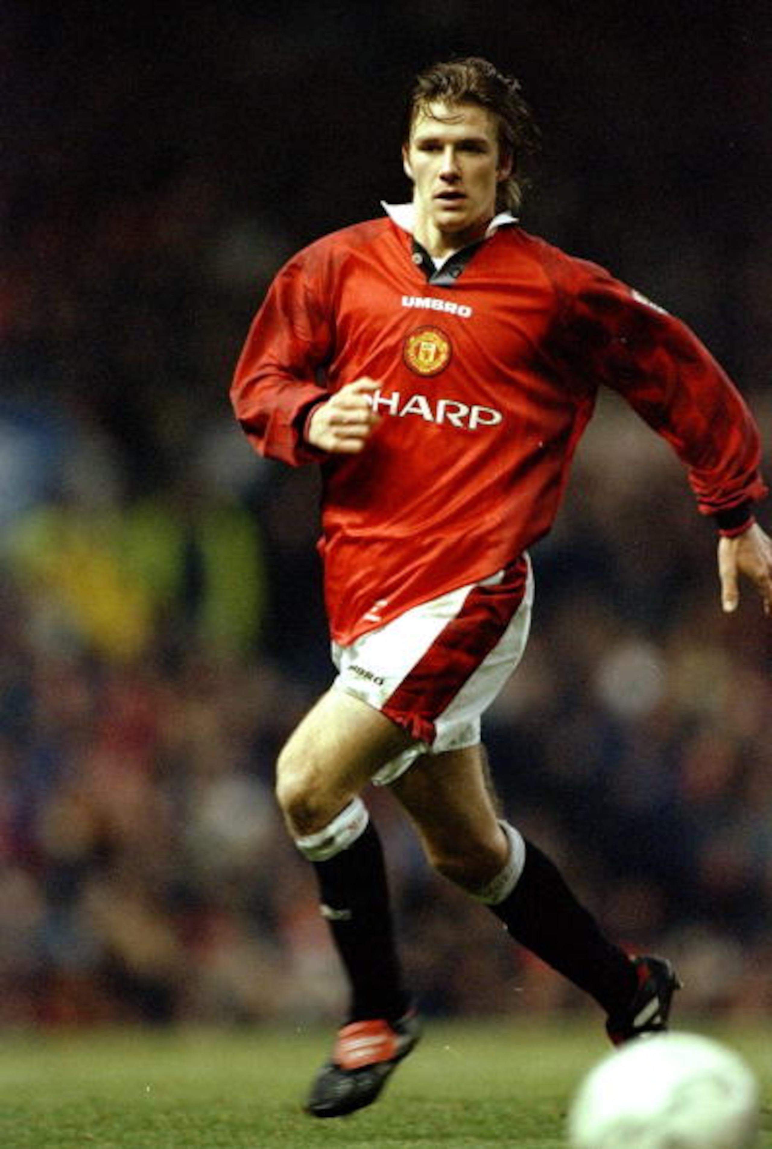 28 Dec 1996: David Beckham of Manchester United in action during the FA Carling Premiership match against Leeds United played at Old Trafford in Manchester, England. Manchester United won the match 1-0. \ Mandatory Credit: Clive Brunskill/Allsport 28 Dec 1996: David Beckham of Manchester United in action during the FA Carling Premiership match against Leeds United played at Old Trafford in Manchester, England. Manchester United won the match 1-0. \ Mandatory Credit: Clive Brunskill/Allsport