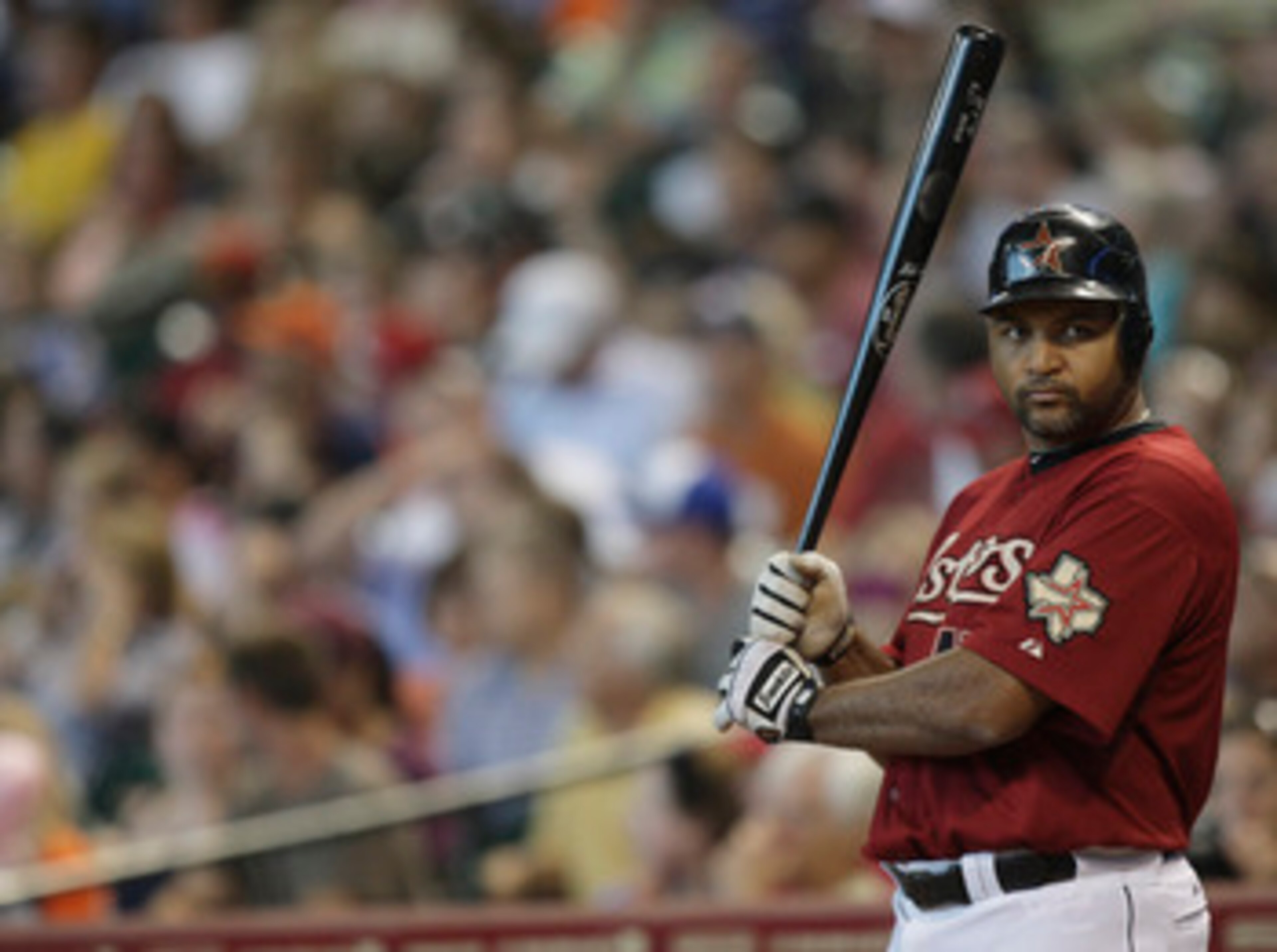 HOUSTON - JUNE 12:  Carlos Lee #45 of the Houston Astors waits on deck during a baseball game against the Atlanta Braves at Minute Maid Park on June 12, 2011 in Houston, Texas.  (Photo by Bob Levey/Getty Images)
