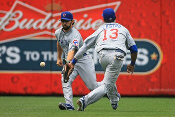 PHILADELPHIA - JUNE 12: Left fielder Blake DeWitt #9 and shortstop Starlin Castro #13 of the Chicago Cubs attempt to field a base hit during a game against the Philadelphia Phillies at Citizens Bank Park on June 12, 2011 in Philadelphia, Pennsylvania. (Ph PHILADELPHIA - JUNE 12: Left fielder Blake DeWitt #9 and shortstop Starlin Castro #13 of the Chicago Cubs attempt to field a base hit during a game against the Philadelphia Phillies at Citizens Bank Park on June 12, 2011 in Philadelphia, Pennsylvania. (Ph