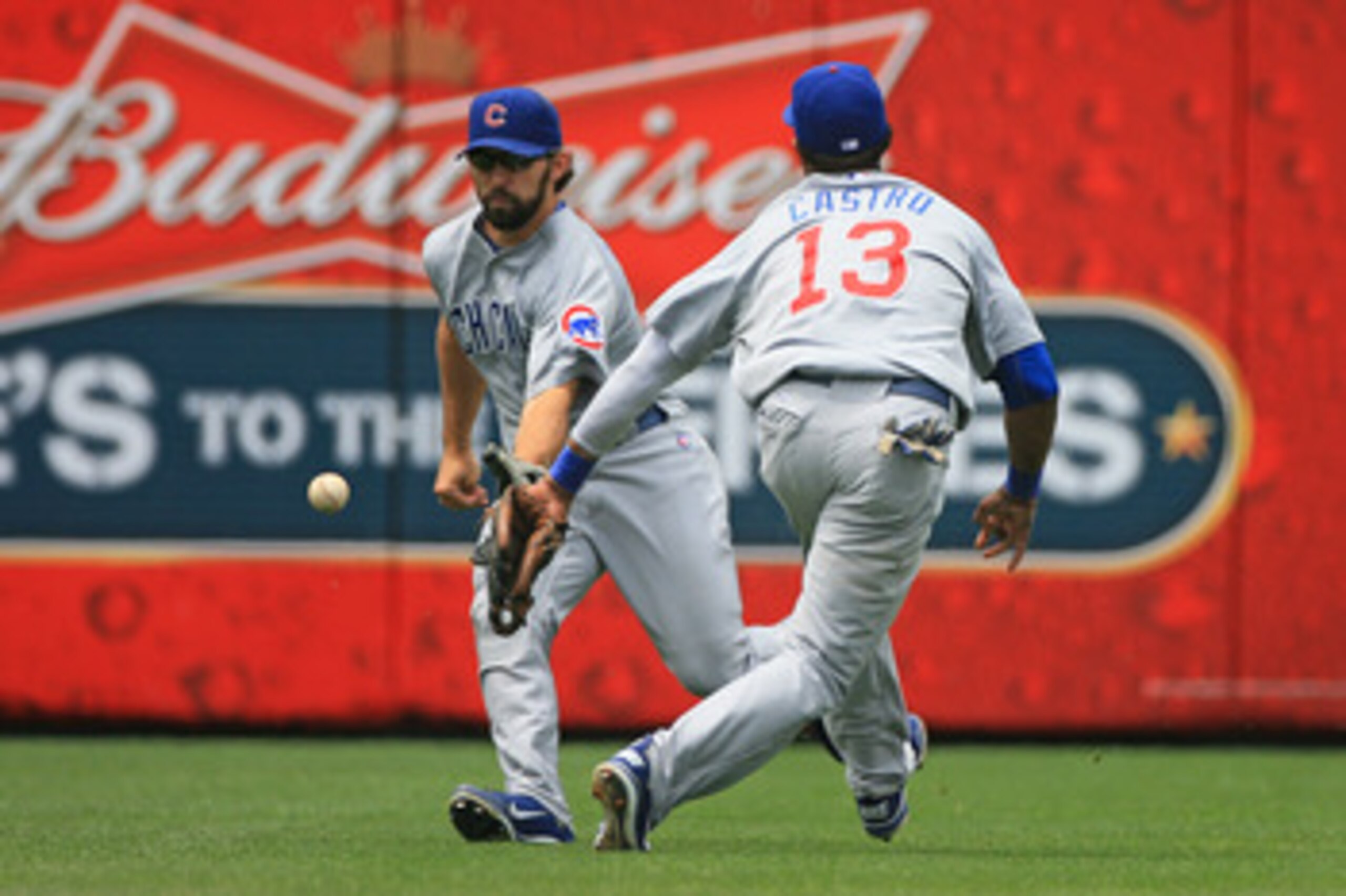 PHILADELPHIA - JUNE 12: Left fielder Blake DeWitt #9 and shortstop Starlin Castro #13 of the Chicago Cubs attempt to field a base hit during a game against the Philadelphia Phillies at Citizens Bank Park on June 12, 2011 in Philadelphia, Pennsylvania. (Ph