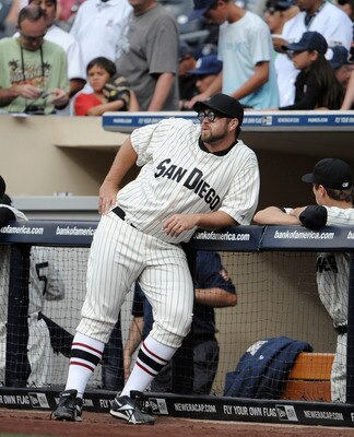SAN DIEGO, CA - JUNE 11: Heath Bell #21 of the San Diego Padres, wearing a throwback uniform, leans on the rail before a baseball game against the Washington Nationals at Petco Park on June 11, 2011 in San Diego, California. (Photo by Denis Poroy/Getty SAN DIEGO, CA - JUNE 11: Heath Bell #21 of the San Diego Padres, wearing a throwback uniform, leans on the rail before a baseball game against the Washington Nationals at Petco Park on June 11, 2011 in San Diego, California. (Photo by Denis Poroy/Getty