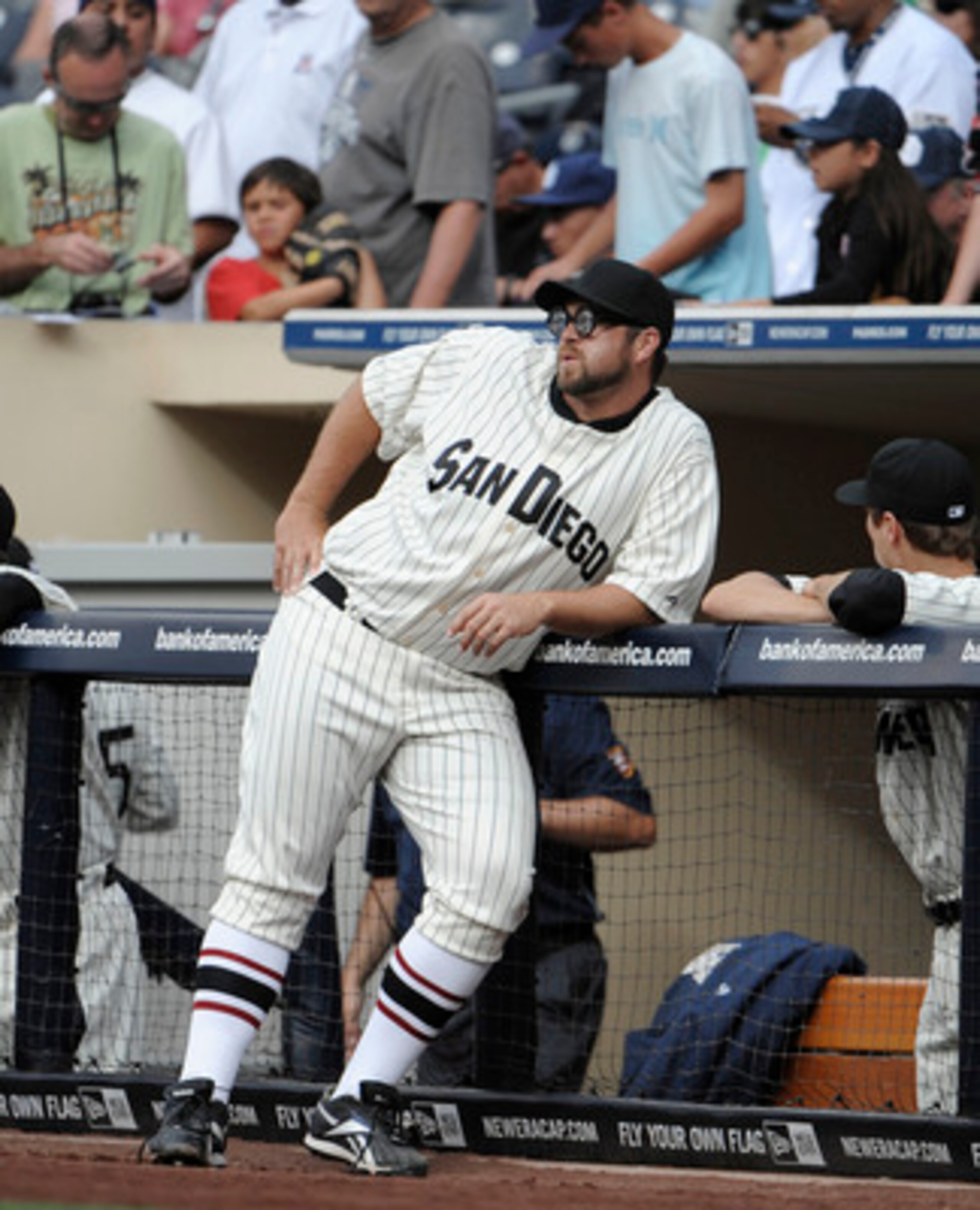 SAN DIEGO, CA - JUNE 11: Heath Bell #21 of the San Diego Padres, wearing a throwback uniform, leans on the rail before a baseball game against the Washington Nationals at Petco Park on June 11, 2011 in San Diego, California.   (Photo by Denis Poroy/Getty