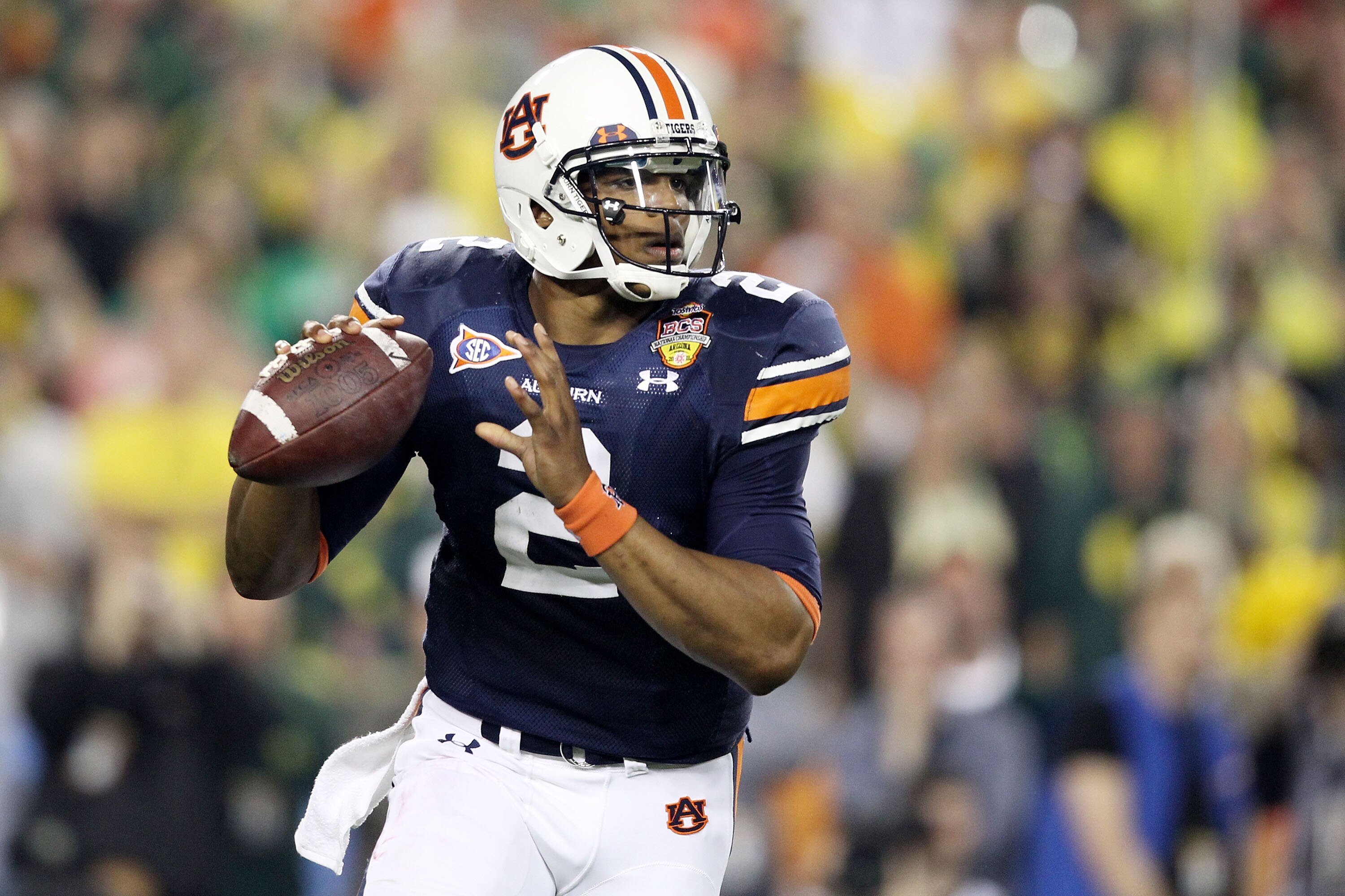 GLENDALE, AZ - JANUARY 10:  Cameron Newton #2 of the Auburn Tigers scrambles against the Oregon Ducks during the Tostitos BCS National Championship Game at University of Phoenix Stadium on January 10, 2011 in Glendale, Arizona.  (Photo by Christian Peters