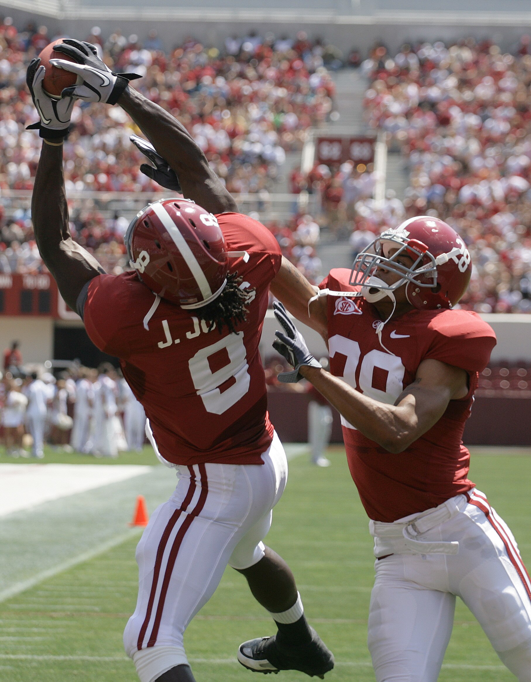 TUSCALOOSA, AL - APRIL 17:  Receiver Julio Jones #8 of the University of Alabama catches a pass as DeMarcus Milliner #28 defends during the Alabama spring game at Bryant Denny Stadium on April 17, 2010 in Tuscaloosa, Alabama. (Photo by Dave Martin/Getty I