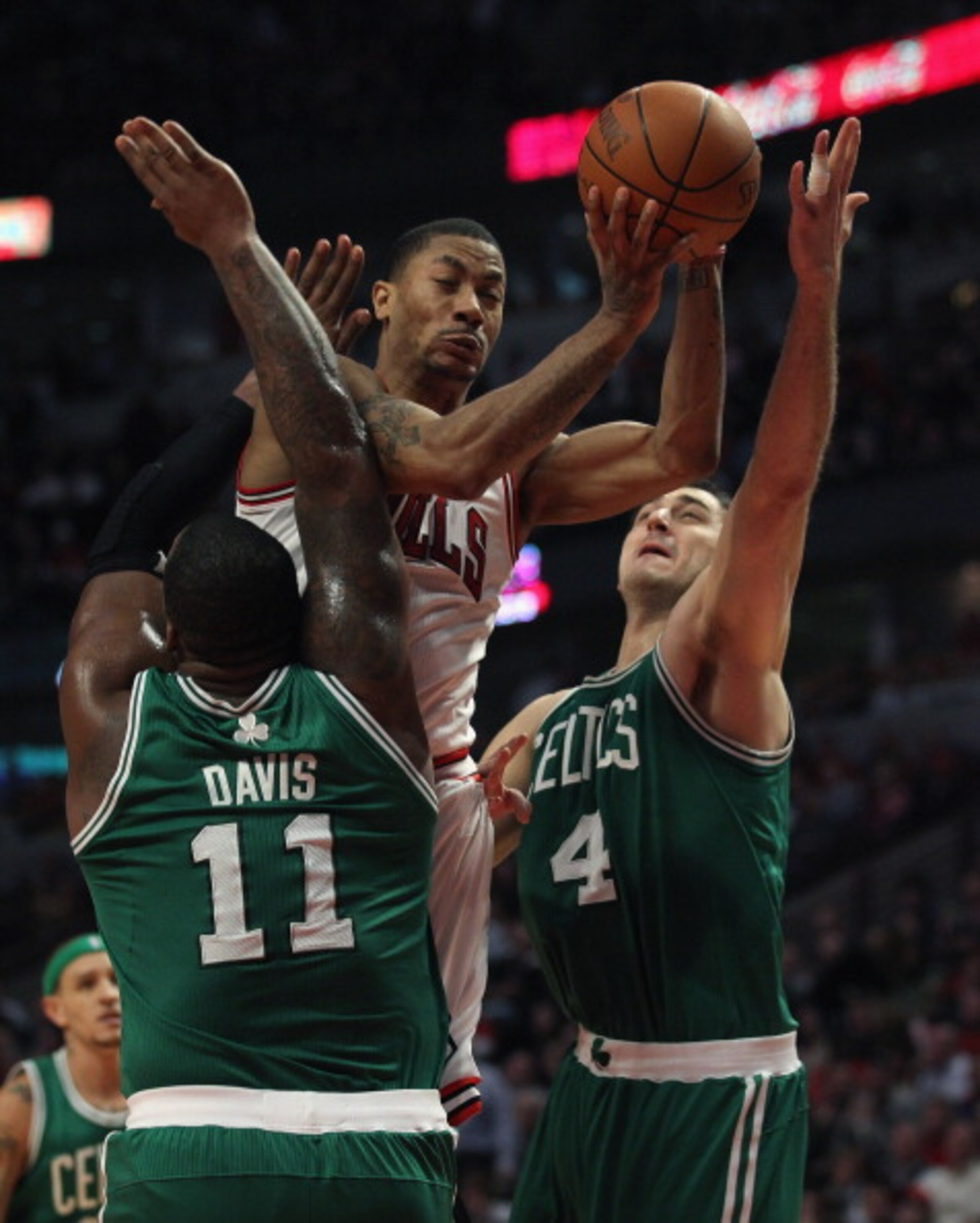 CHICAGO, IL - APRIL 07: Derrick Rose #1 of the Chicago Bulls is called for a charge as he attempts to drive against Glen Davis #11 and Nenad Krstic #4 of the Boston Celtics at United Center on April 7, 2011 in Chicago, Illinois. The Bulls defeated the Cel CHICAGO, IL - APRIL 07: Derrick Rose #1 of the Chicago Bulls is called for a charge as he attempts to drive against Glen Davis #11 and Nenad Krstic #4 of the Boston Celtics at United Center on April 7, 2011 in Chicago, Illinois. The Bulls defeated the Cel