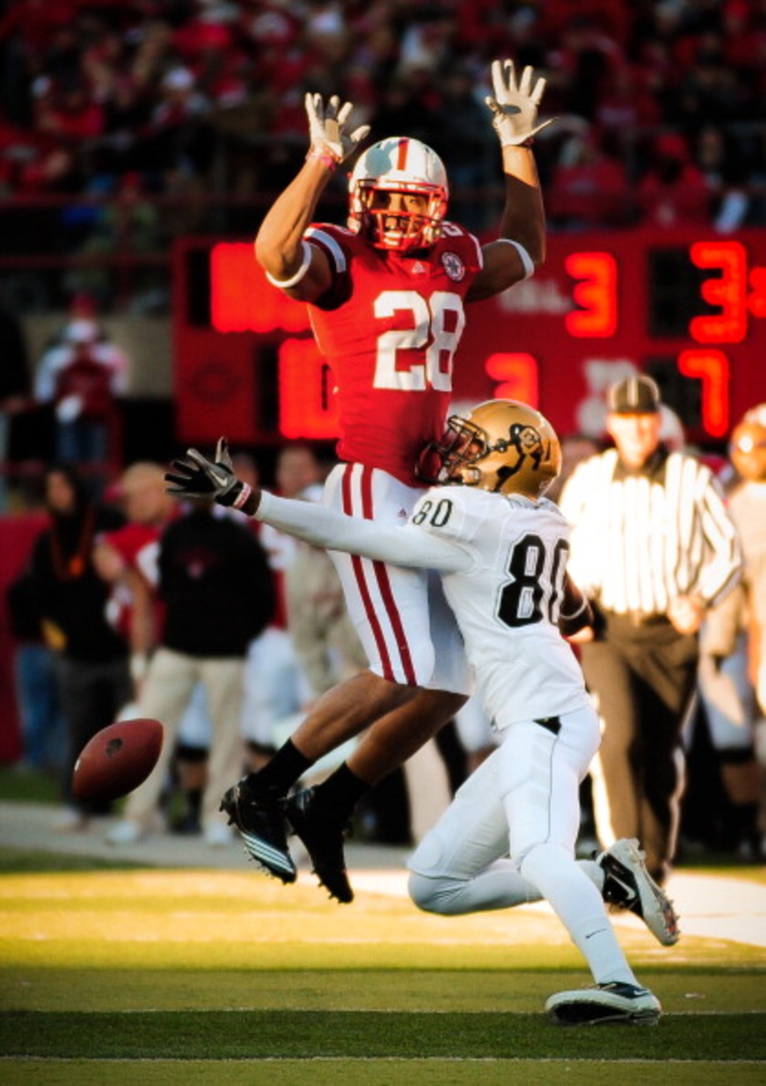 LINCOLN, NE - NOVEMBER 26: Eric Hagg #28 of the Nebraska Cornhuskers attempts to not interfere with Paul Richardson #80 of the Colorado Buffaloes during their game at Memorial Stadium on November 26, 2010 in Lincoln, Nebraska. Nebraska defeated Colorado 4 LINCOLN, NE - NOVEMBER 26: Eric Hagg #28 of the Nebraska Cornhuskers attempts to not interfere with Paul Richardson #80 of the Colorado Buffaloes during their game at Memorial Stadium on November 26, 2010 in Lincoln, Nebraska. Nebraska defeated Colorado 4