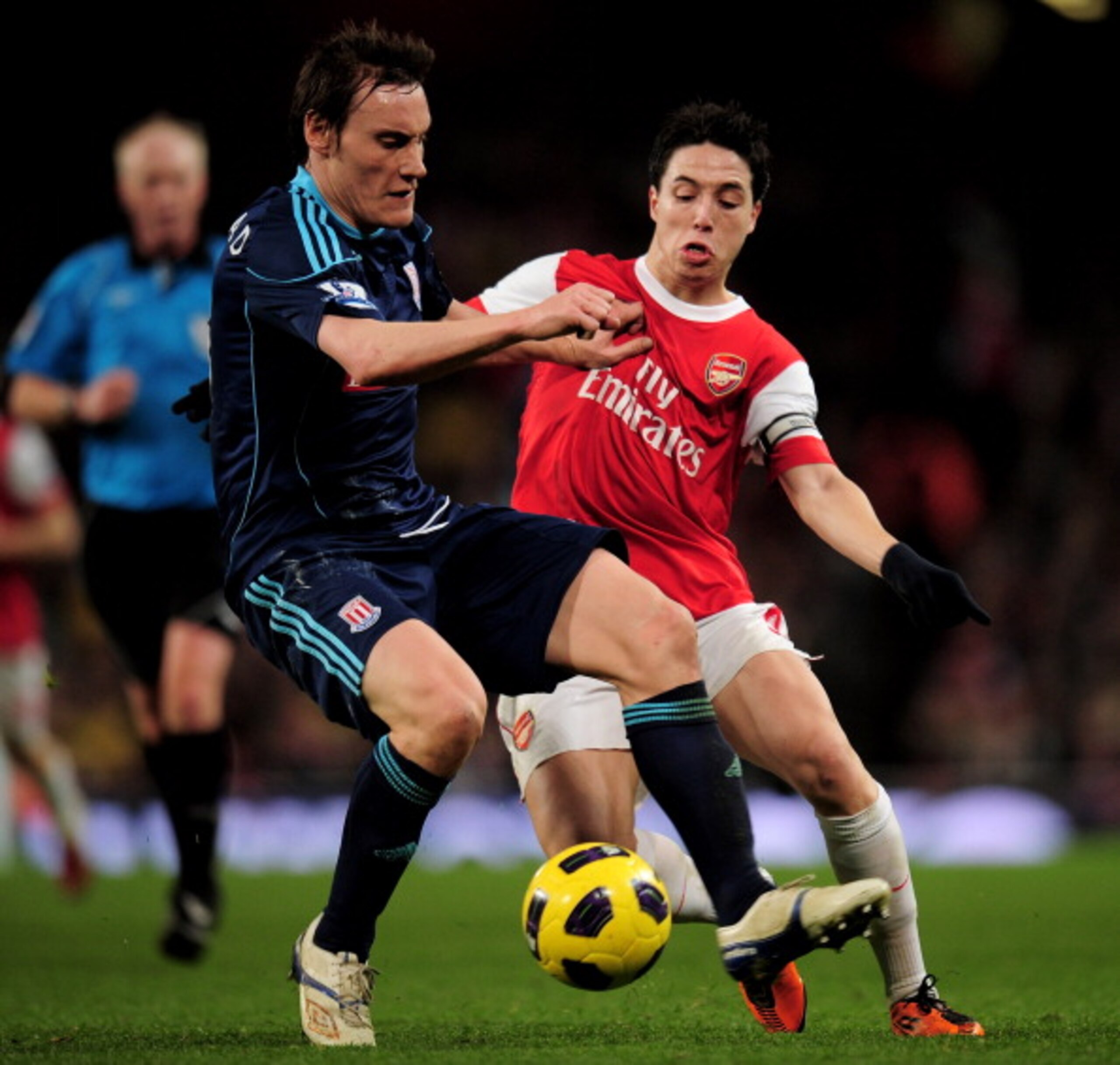 LONDON, ENGLAND - FEBRUARY 23:  Samir Nasri (R) of Arsenal is challenged by Dean Whitehead of Stoke during the Barclays Premier League match between Arsenal and Stoke City at the Emirates Stadium on February 23, 2011 in London, England.  (Photo by Shaun B
