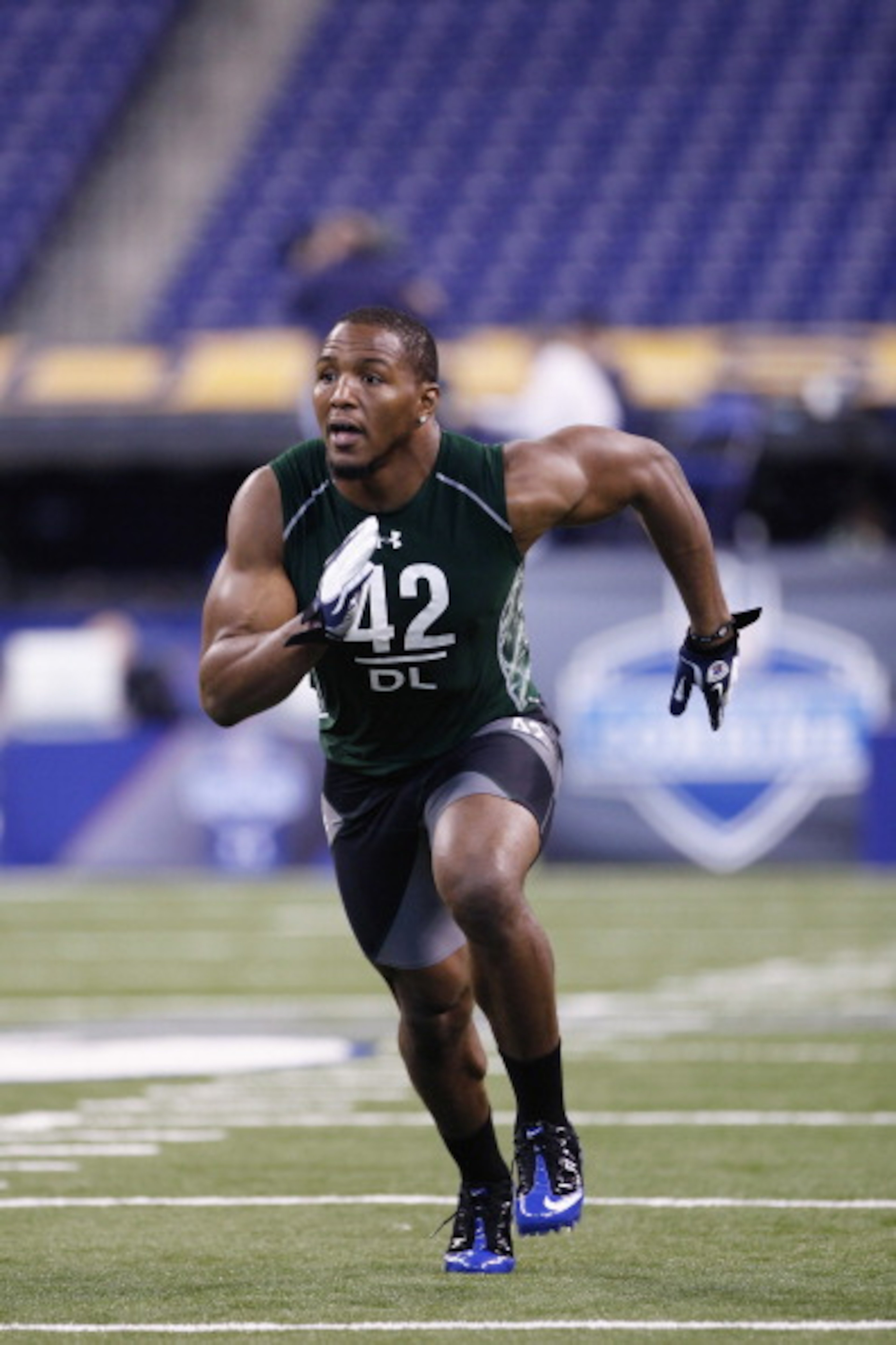 INDIANAPOLIS, IN - FEBRUARY 28: Defensive lineman Robert Quinn of North Carolina runs through a drill during the 2011 NFL Scouting Combine at Lucas Oil Stadium on February 28, 2011 in Indianapolis, Indiana. (Photo by Joe Robbins/Getty Images) INDIANAPOLIS, IN - FEBRUARY 28: Defensive lineman Robert Quinn of North Carolina runs through a drill during the 2011 NFL Scouting Combine at Lucas Oil Stadium on February 28, 2011 in Indianapolis, Indiana. (Photo by Joe Robbins/Getty Images)