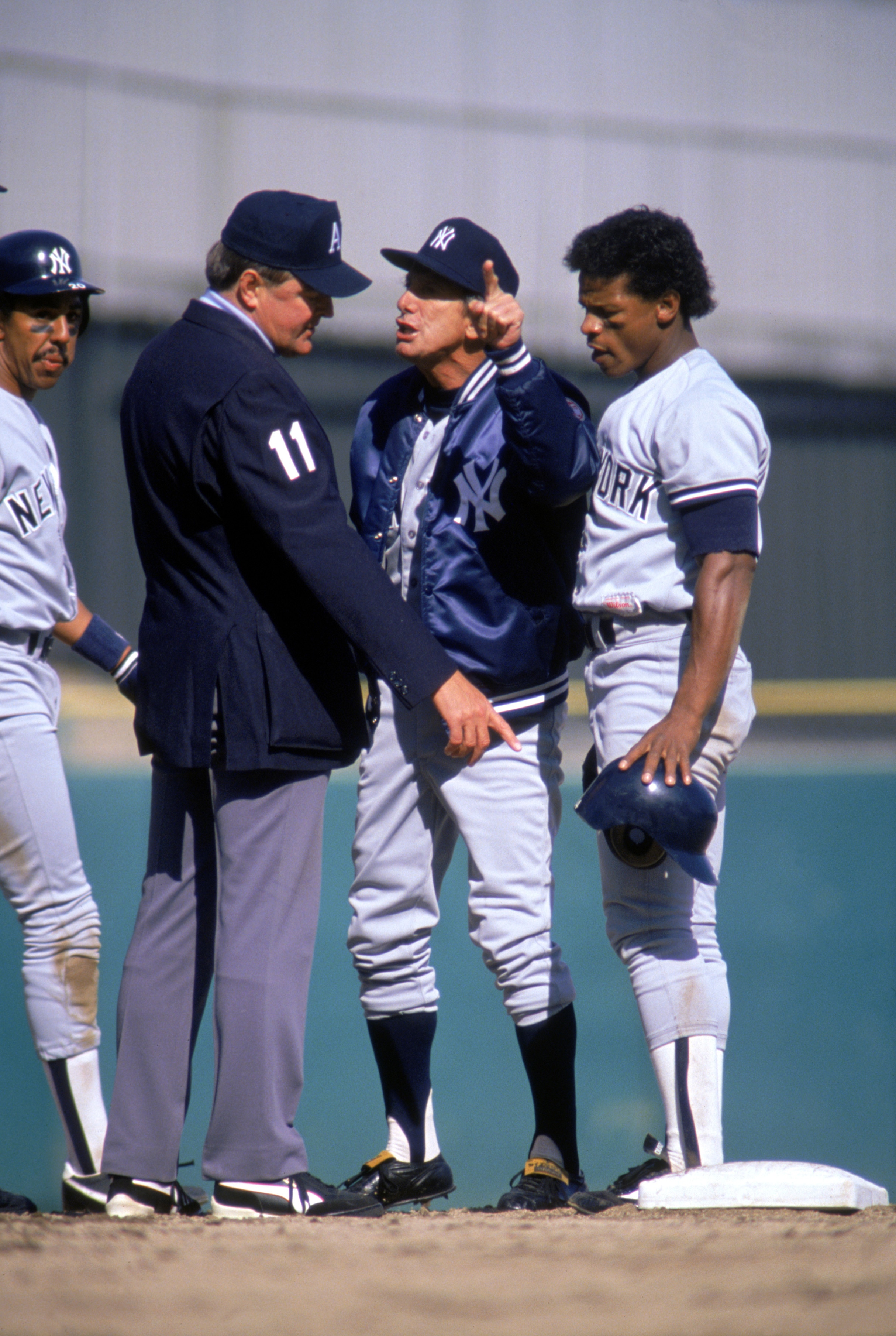 BRONX, NEW YORK - APRIL 7: Manager Billy Martin of the New York Yankees argues with an umpire as outfielder Rickey Henderson #24 watches during the game on April 7, 1988 at Yankee Stadium in Bronx, New York. (Photo by Jonathan Daniel/Getty Images) BRONX, NEW YORK - APRIL 7: Manager Billy Martin of the New York Yankees argues with an umpire as outfielder Rickey Henderson #24 watches during the game on April 7, 1988 at Yankee Stadium in Bronx, New York. (Photo by Jonathan Daniel/Getty Images)