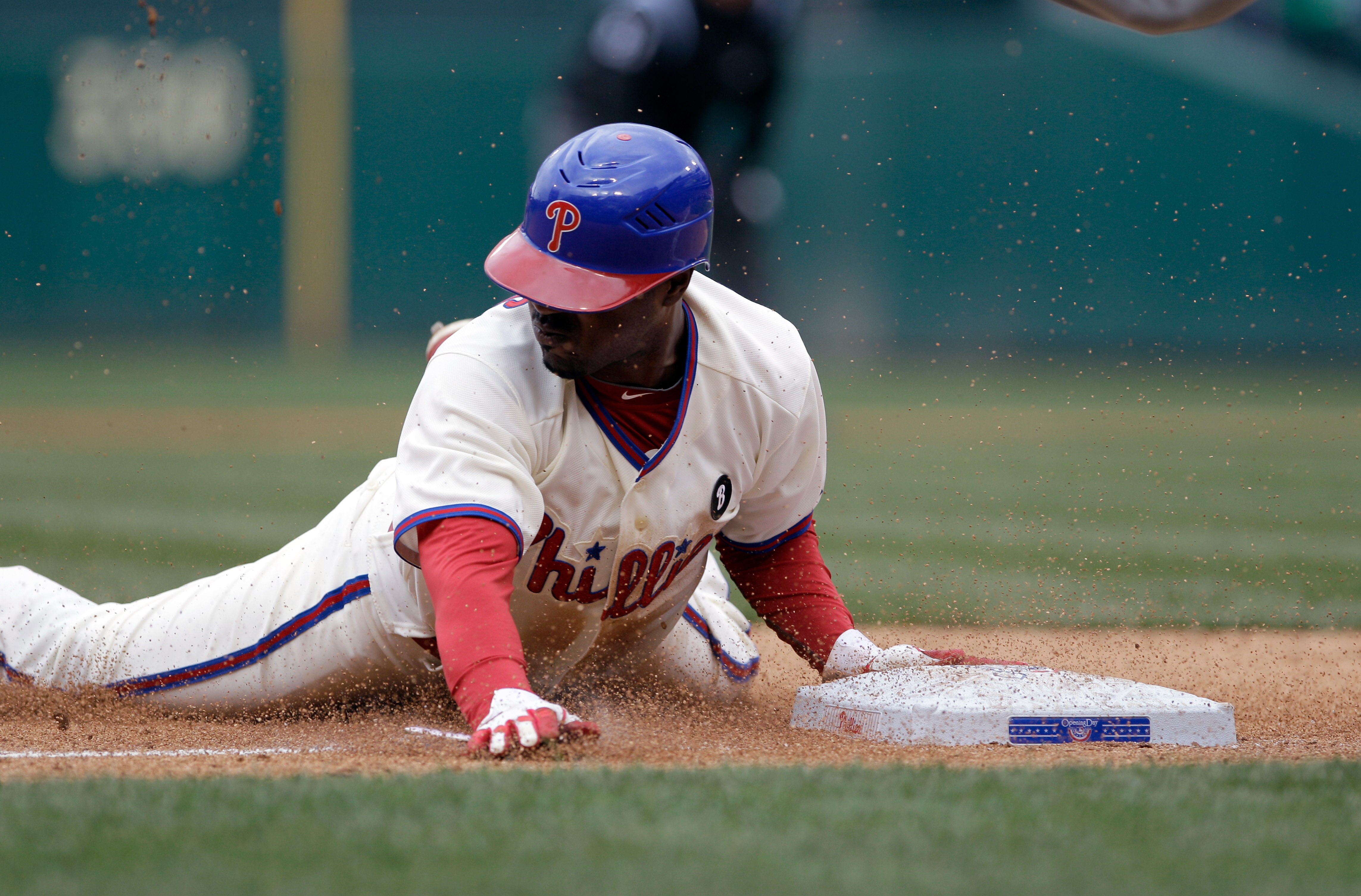 PHILADELPHIA, PA - APRIL 01: Jimmy Rollins #11 of the Philadelphia Phillies slides safely into third base against the Houston Astros during opening day at Citizens Bank Park on April 1, 2011 in Philadelphia, Pennsylvania. (Photo by Rob Carr/Getty Images) PHILADELPHIA, PA - APRIL 01: Jimmy Rollins #11 of the Philadelphia Phillies slides safely into third base against the Houston Astros during opening day at Citizens Bank Park on April 1, 2011 in Philadelphia, Pennsylvania. (Photo by Rob Carr/Getty Images)