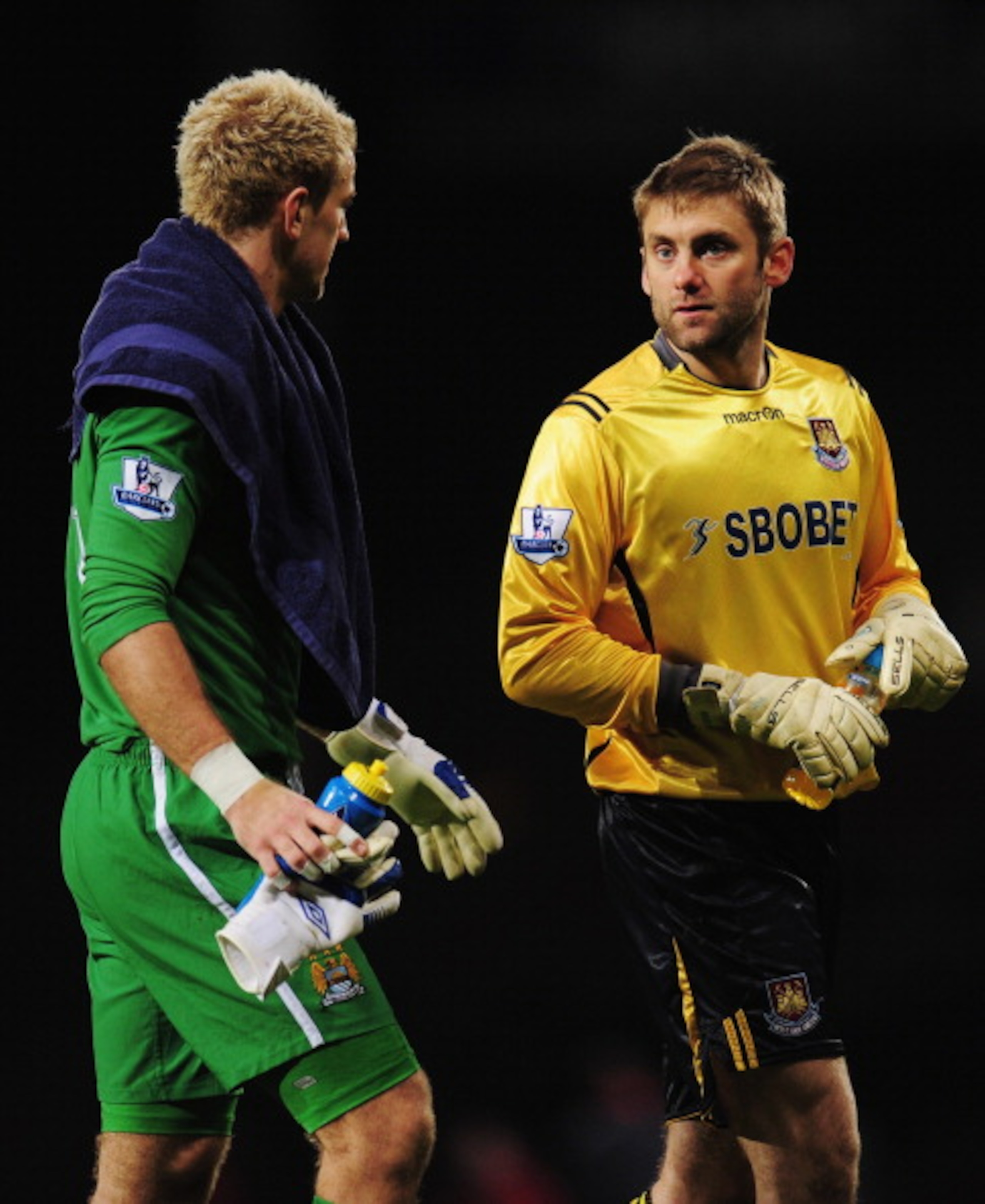 LONDON, UNITED KINGDOM - DECEMBER 11:  Joe Hart (L) the Manchester City goalkeeper talks with Robert Green (R) the West Ham United goalkeeper following the Barclays Premier League match between West Ham United and Manchester City at Upton Park on December