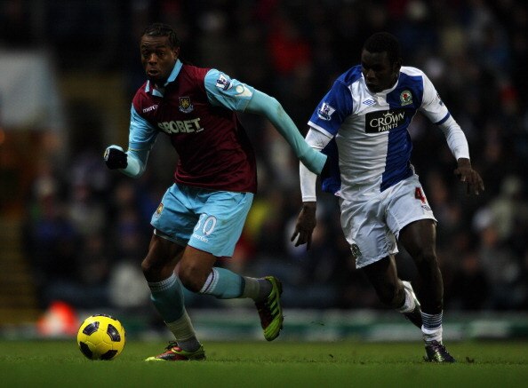 BLACKBURN, ENGLAND - DECEMBER 18:  Mame Biram Diouf of Blackburn chases Frederic Piquionne of West Ham during the Barclays Premier League match between Blackburn Rovers and West Ham United at Ewood park on December 18, 2010 in Blackburn, England.  (Photo