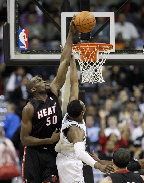 WASHINGTON, DC - MARCH 30: Joel Anthony #50 of the Miami Heat blocks a shot by John Wall #2 of the Washington Wizards during the first half at the Verizon Center on March 30, 2011 in Washington, DC. NOTE TO USER: User expressly acknowledges and agrees tha