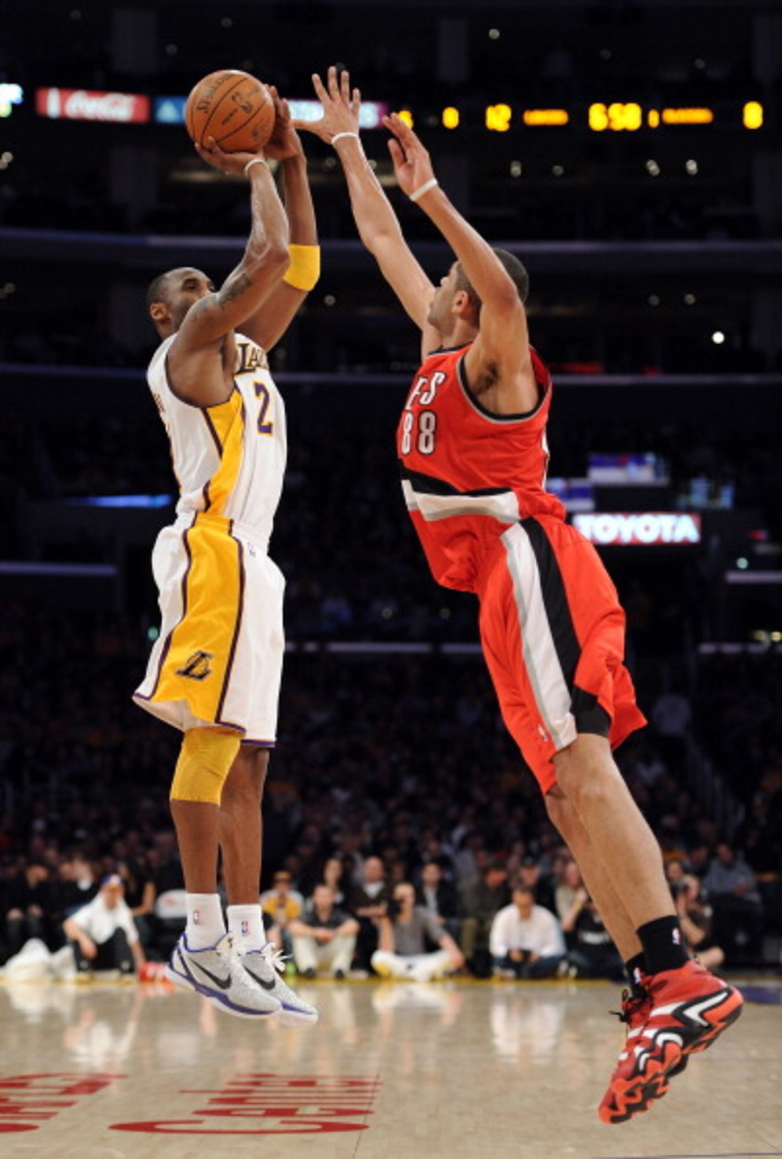 LOS ANGELES, CA - MARCH 20:  Kobe Bryant #24 of the Los Angeles Lakers shoots a jumper over Nicolas Batum #88 of the Portland Trail Blazers at the Staples Center on March 20, 2011 in Los Angeles, California.  NOTE TO USER: User expressly acknowledges and 