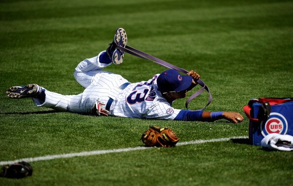 MESA, AZ - MARCH 09:  Starlin Castro #13 of the Chicago Cubs stretches during batting practice before the spring training baseball game against the Kansas City Royals at HoHoKam Stadium on March 9, 2011 in Mesa, Arizona.  (Photo by Kevork Djansezian/Getty