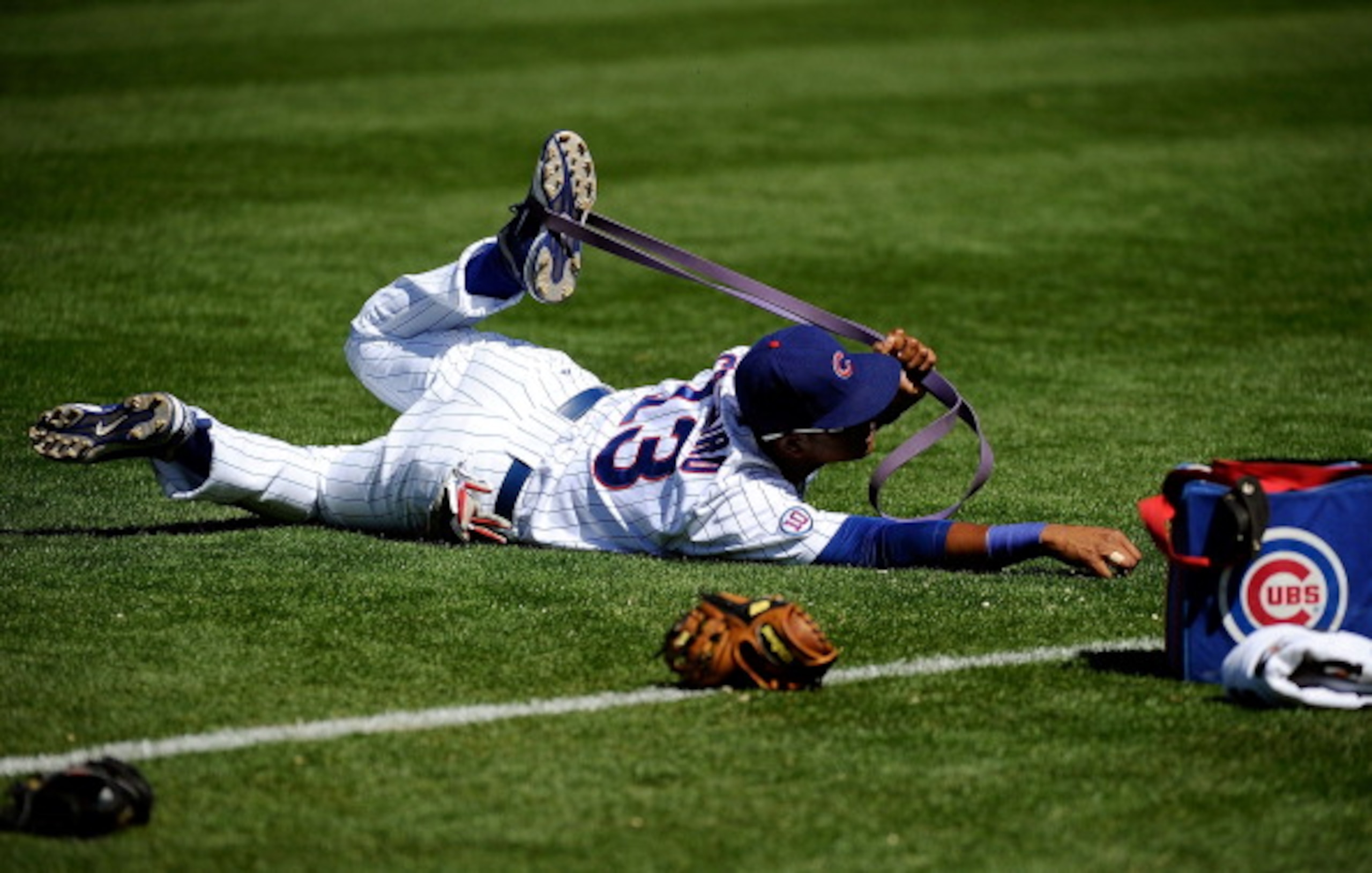 MESA, AZ - MARCH 09:  Starlin Castro #13 of the Chicago Cubs stretches during batting practice before the spring training baseball game against the Kansas City Royals at HoHoKam Stadium on March 9, 2011 in Mesa, Arizona.  (Photo by Kevork Djansezian/Getty