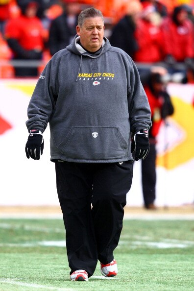 KANSAS CITY, MO - JANUARY 09:  Offensive coordinator Charlie Weis of the Kansas City Chiefs walks in the field prior to playing the Baltimore Ravens in their 2011 AFC wild card playoff game at Arrowhead Stadium on January 9, 2011 in Kansas City, Missouri.