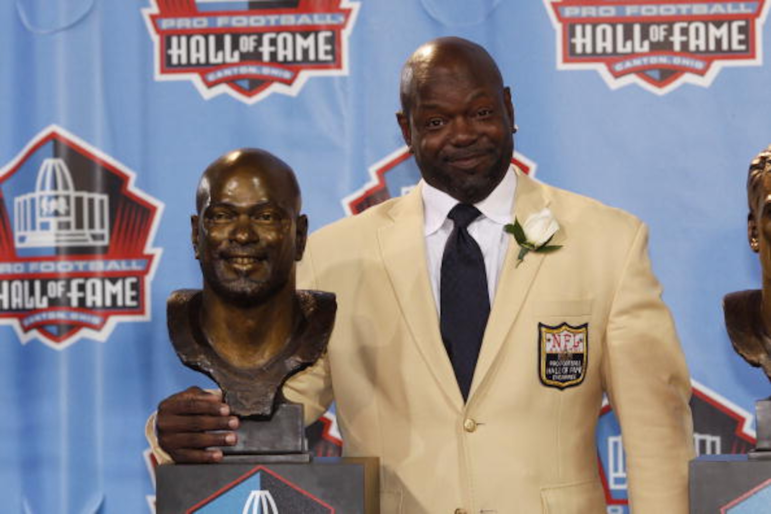 CANTON, OH - AUGUST 7: Emmitt Smith poses with his bust during the 2010 Pro Football Hall of Fame Enshrinement Ceremony at the Pro Football Hall of Fame Field at Fawcett Stadium on August 7, 2010 in Canton, Ohio. (Photo by Joe Robbins/Getty Images)
