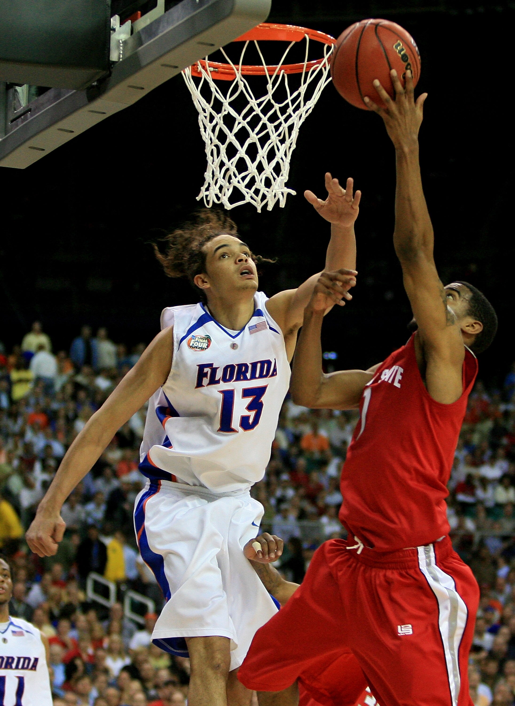 ATLANTA - APRIL 02:  Joakim Noah #13 of the Florida Gators fights for a rebound with Mike Conley Jr #1 of the Ohio State Buckeyes during the NCAA Men's Basketball Championship game at the Georgia Dome on April 2, 2007 in Atlanta, Georgia.  (Photo by Stree