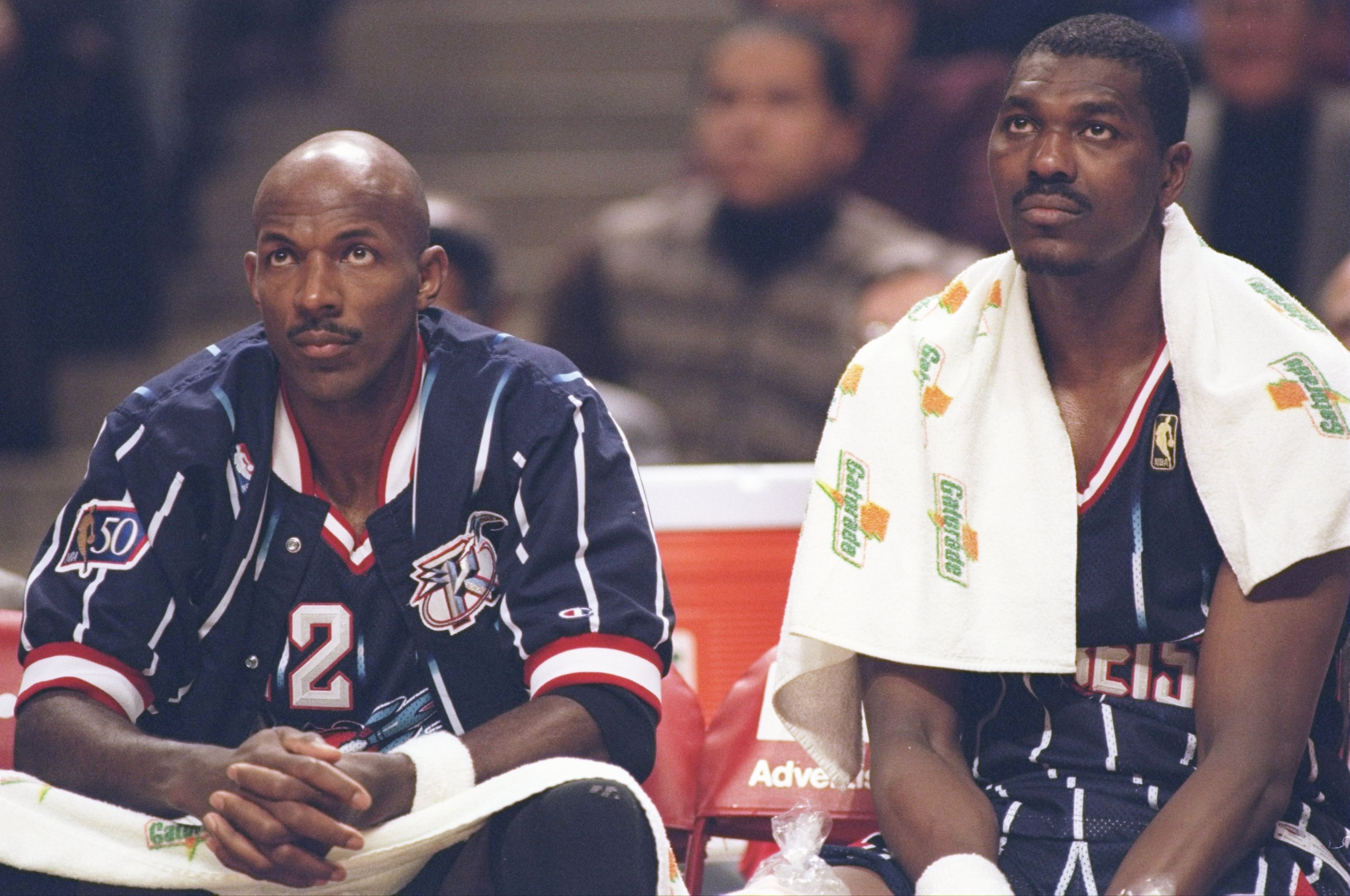 11 Nov 1997:  Guard Clyde Drexler and center Hakeem Olajuwon of the Houston Rockets sit on the bench during a game against the Chicago Bulls at the United Center in Chicago, Illinois.  The Bulls won the game 110-86. Mandatory Credit: Brian Bahr  /Allsport