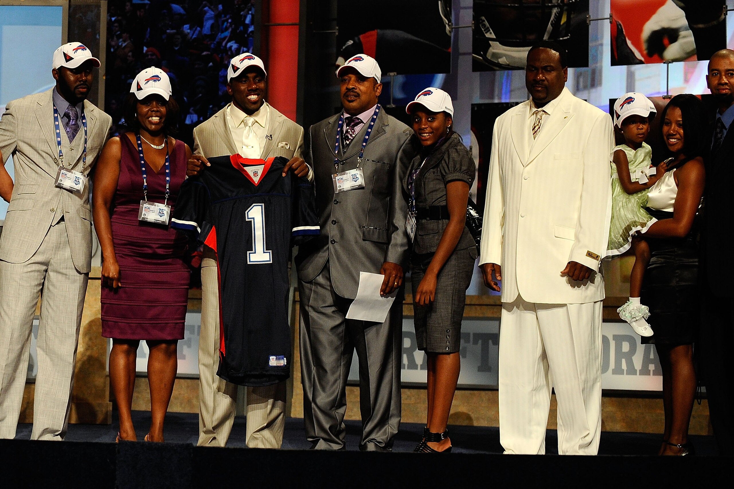 NEW YORK - APRIL 22: C.J. Spiller from the Clemson Tigers holds up a Buffalo Bills jersey as he poses with friends and family after he was selected number 9 overall by the Bills during the first round of the 2010 NFL Draft at Radio City Music Hall on Apr NEW YORK - APRIL 22: C.J. Spiller from the Clemson Tigers holds up a Buffalo Bills jersey as he poses with friends and family after he was selected number 9 overall by the Bills during the first round of the 2010 NFL Draft at Radio City Music Hall on Apr