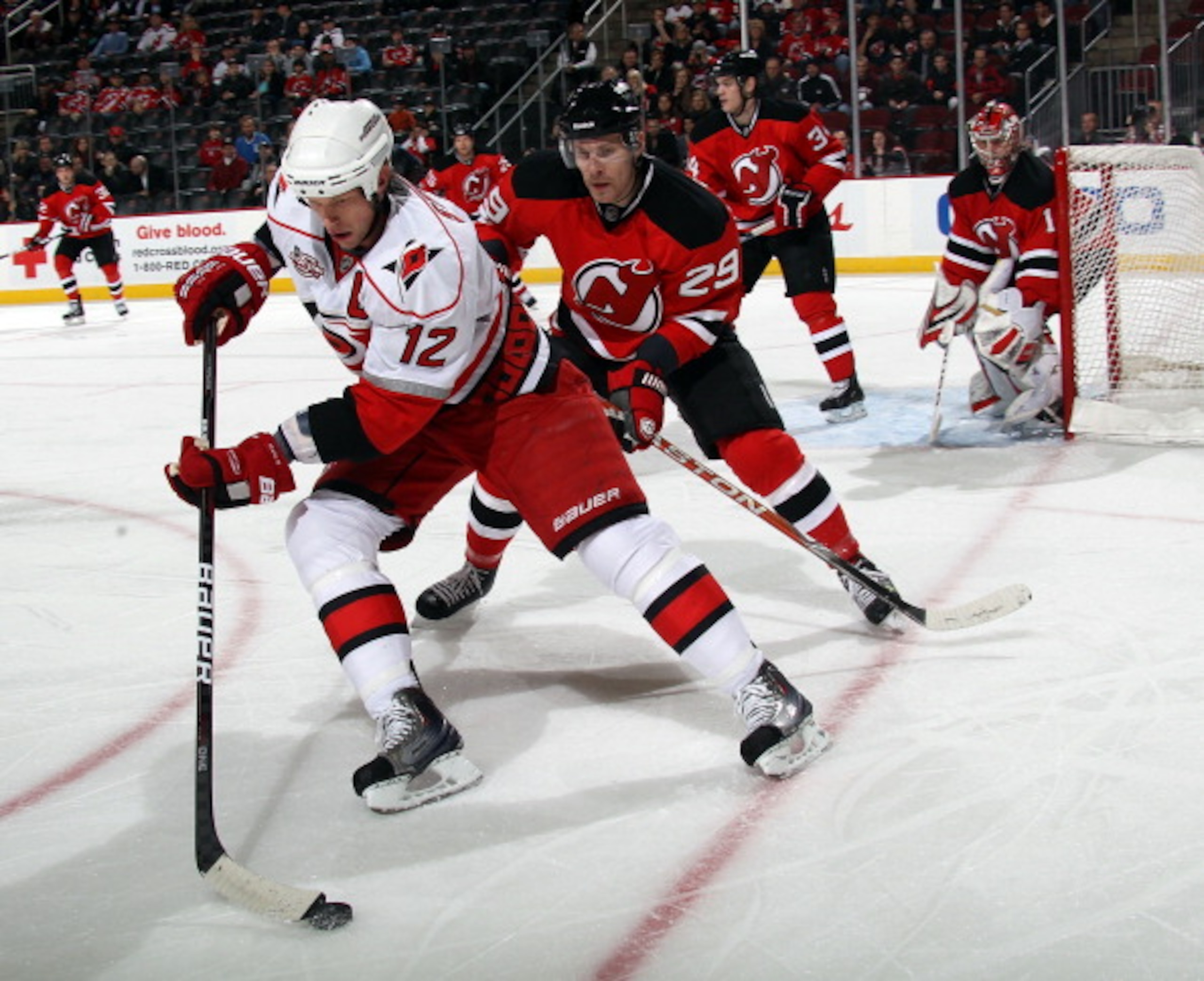 NEWARK, NJ - FEBRUARY 16:  Eric Staal #12 of the Carolina Hurricanes skates against the New Jersey Devils at the Prudential Center on February 16, 2011 in Newark, New Jersey.  (Photo by Bruce Bennett/Getty Images)