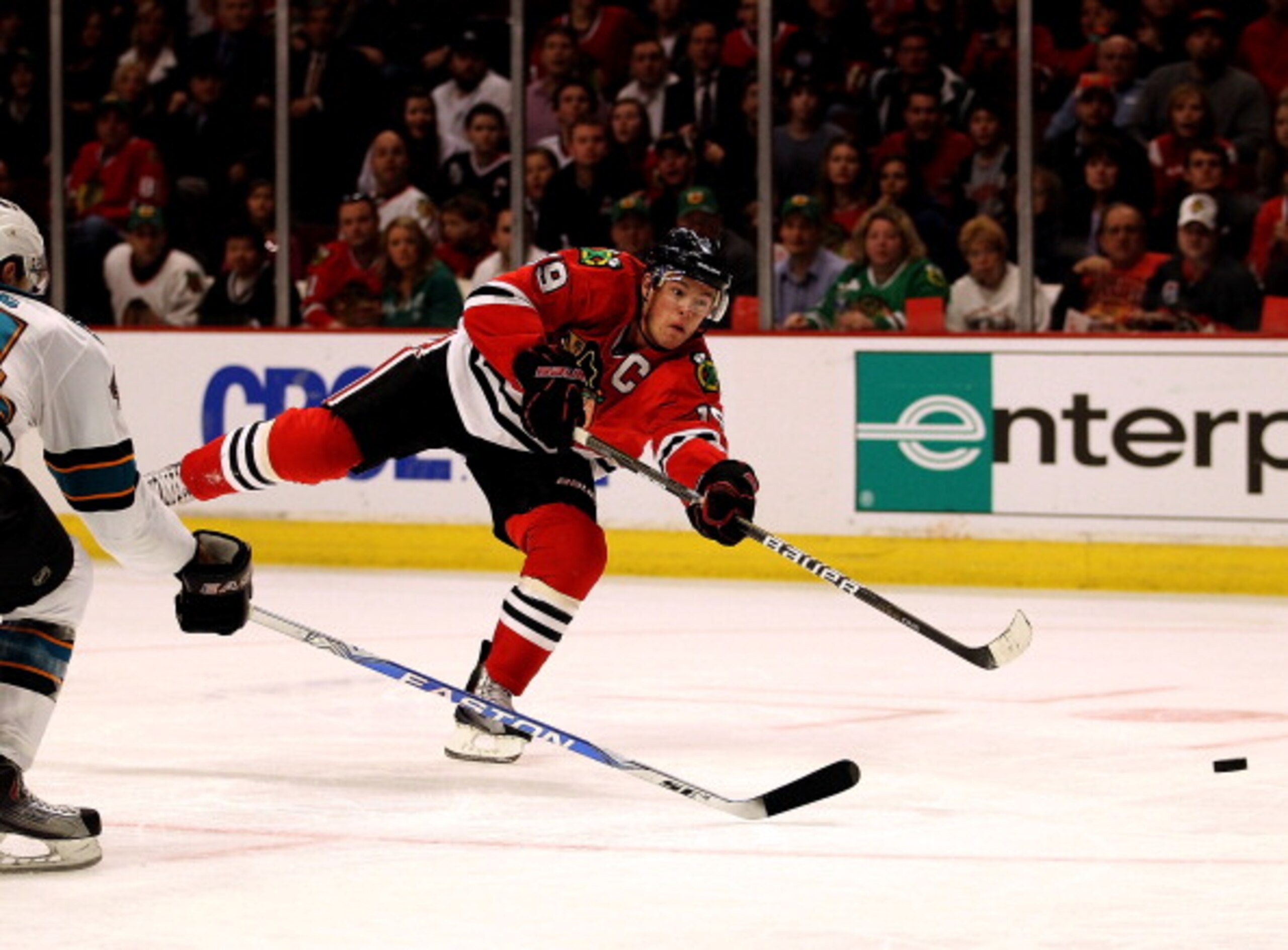 CHICAGO, IL - MARCH 14: Jonathan Toews #19 of the Chicago Blackhawks shoots the puck for a goal in the second period against the San Jose Sharks at the United Center on March 14, 2011 in Chicago, Illinois. The Blackhawks defeated the Sharks 6-3. (Photo by