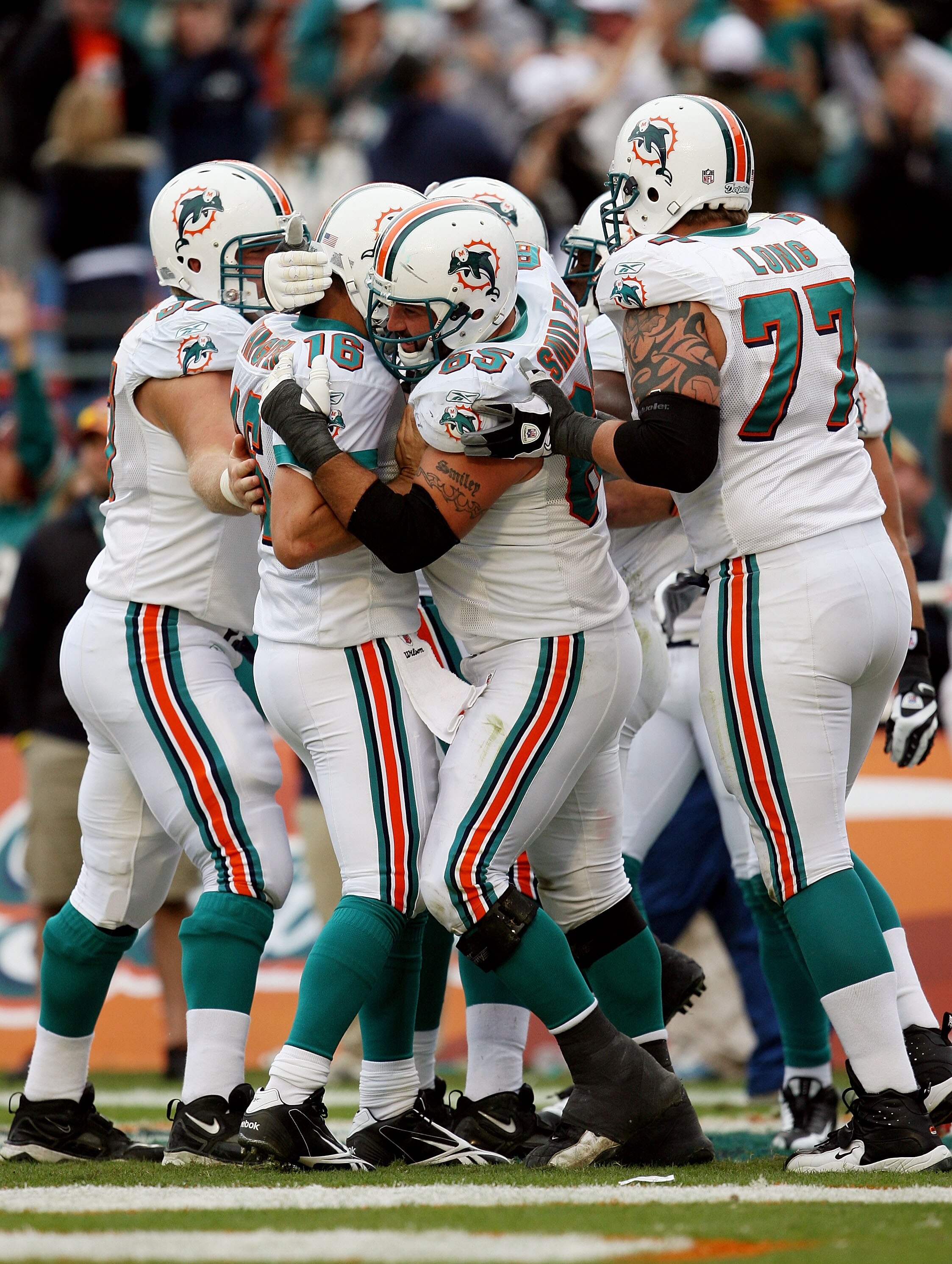 MIAMI - JANUARY 03:  Quarterback Tyler Thigpen #16 of the Miami Dolphins celebrates with teammates after throwing a touchdown pass (his first as a Dolphin), to Davone Bess #15 against the Pittsburgh Steelers at Land Shark Stadium on January 3, 2010 in Mia
