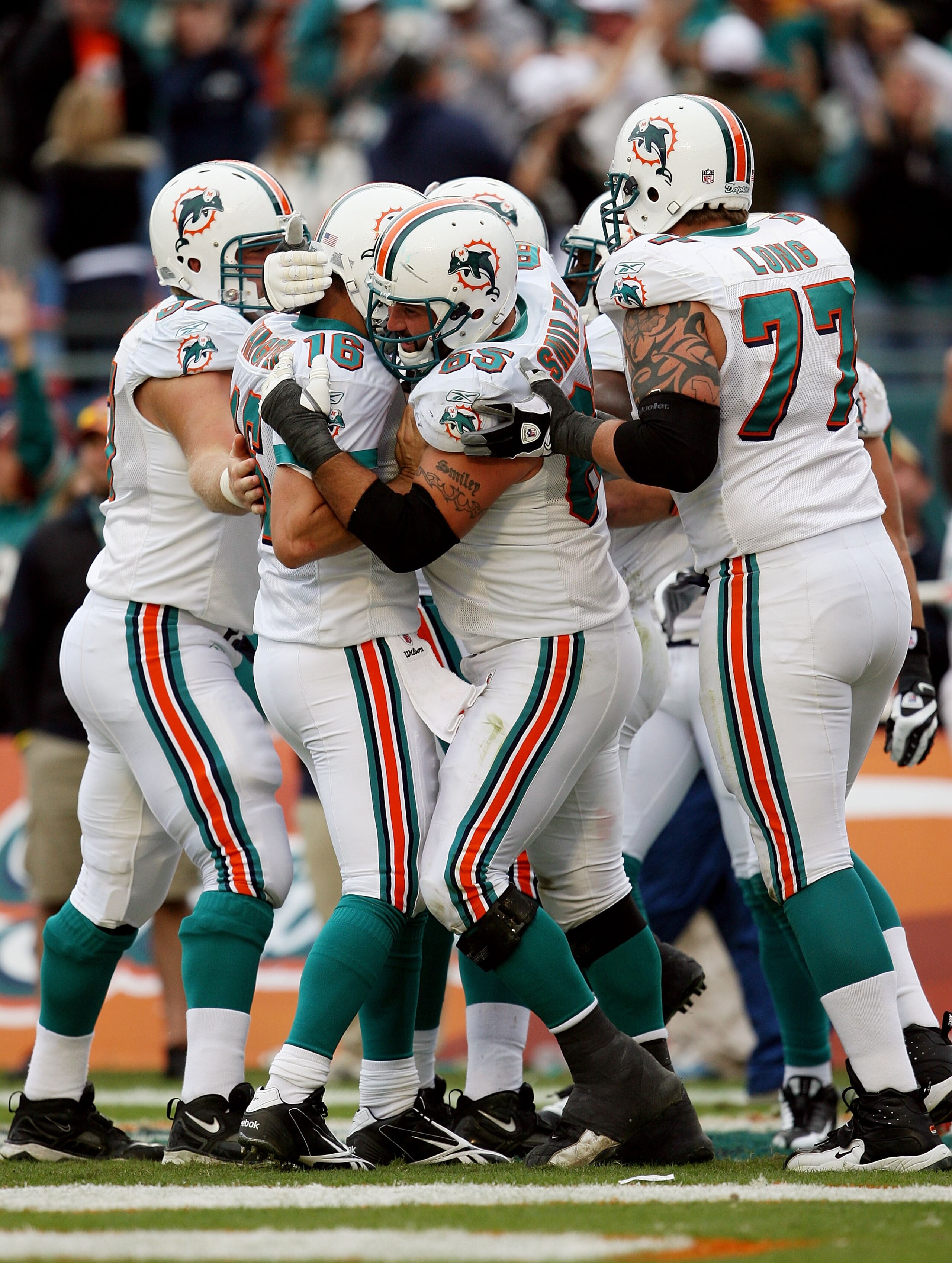 MIAMI - JANUARY 03:  Quarterback Tyler Thigpen #16 of the Miami Dolphins celebrates with teammates after throwing a touchdown pass (his first as a Dolphin), to Davone Bess #15 against the Pittsburgh Steelers at Land Shark Stadium on January 3, 2010 in Mia