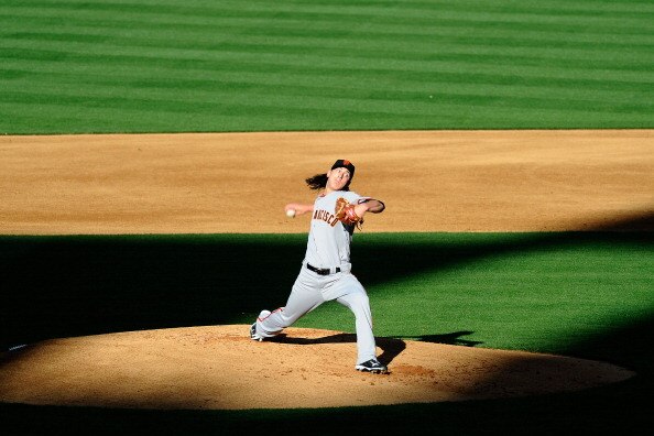 LOS ANGELES, CA - MARCH 31:  Tim Lincecum #55 of the San Francisco Giants throws a pitch against the Los Angeles Dodgers on Opening Day at Dodger Stadium on March 31, 2011 in Los Angeles, California.  (Photo by Kevork Djansezian/Getty Images)