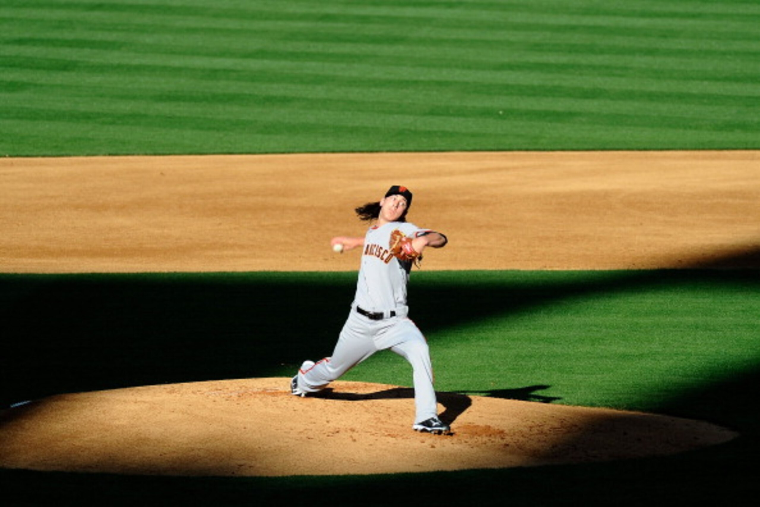 LOS ANGELES, CA - MARCH 31:  Tim Lincecum #55 of the San Francisco Giants throws a pitch against the Los Angeles Dodgers on Opening Day at Dodger Stadium on March 31, 2011 in Los Angeles, California.  (Photo by Kevork Djansezian/Getty Images)
