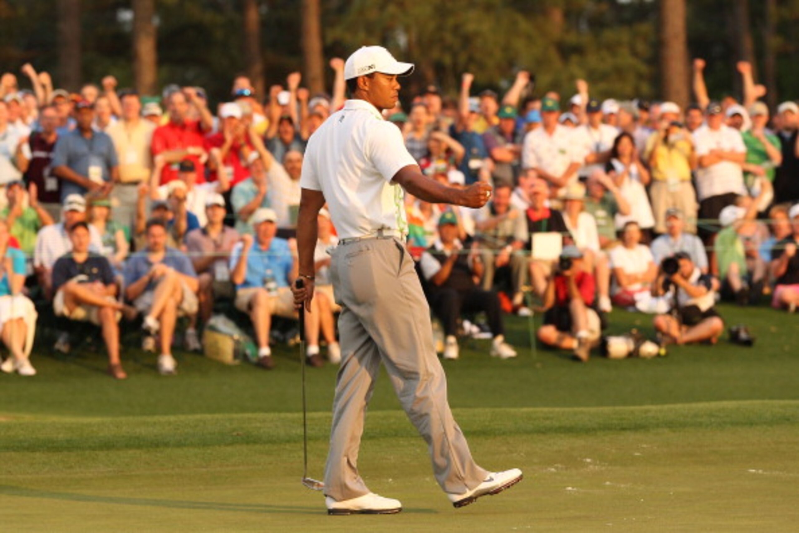 AUGUSTA, GA - APRIL 08:  Tiger Woods celebrates his birdie putt on the 18th green during the second round of the 2011 Masters Tournament at Augusta National Golf Club on April 8, 2011 in Augusta, Georgia.  (Photo by Andrew Redington/Getty Images)
