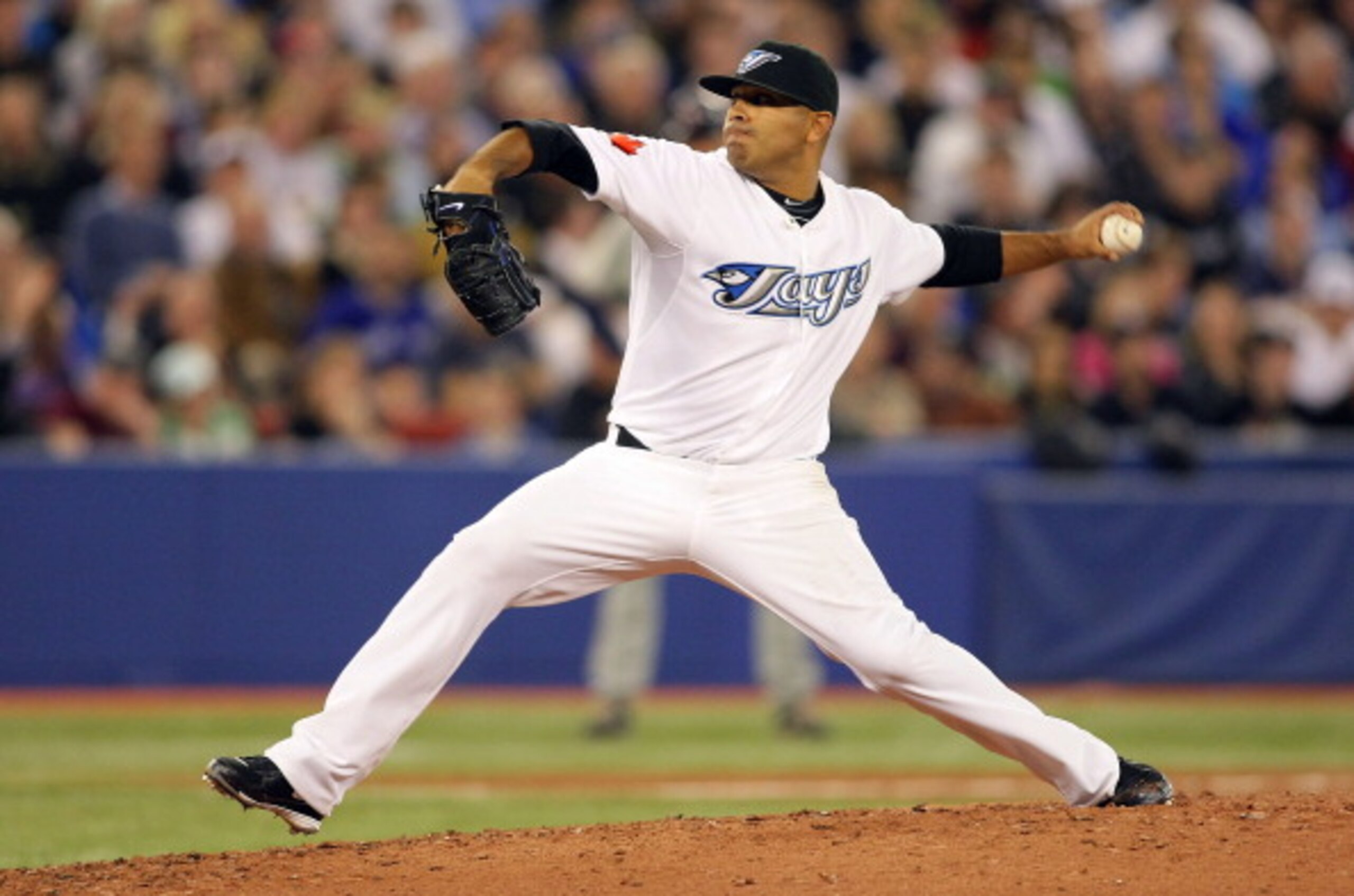 TORONTO,CANADA - APRIL 1:  Ricky Romero #24 of the Toronto Blue Jays throws a pitch against the Minnesota Twins on opening day during their MLB game at the Rogers Centre April 1, 2011 in Toronto, Ontario, Canada.(Photo By Dave Sandford/Getty Images)