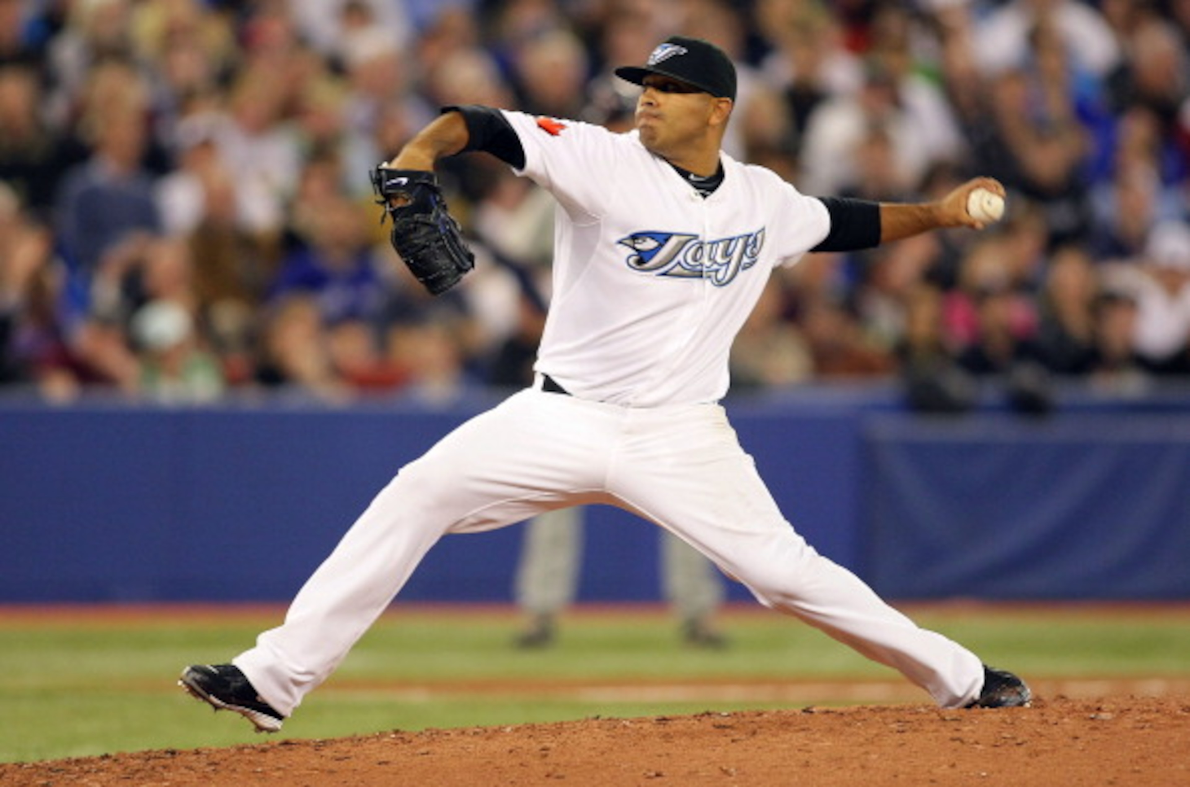 TORONTO,CANADA - APRIL 1: Ricky Romero #24 of the Toronto Blue Jays throws a pitch against the Minnesota Twins on opening day during their MLB game at the Rogers Centre April 1, 2011 in Toronto, Ontario, Canada.(Photo By Dave Sandford/Getty Images) TORONTO,CANADA - APRIL 1: Ricky Romero #24 of the Toronto Blue Jays throws a pitch against the Minnesota Twins on opening day during their MLB game at the Rogers Centre April 1, 2011 in Toronto, Ontario, Canada.(Photo By Dave Sandford/Getty Images)
