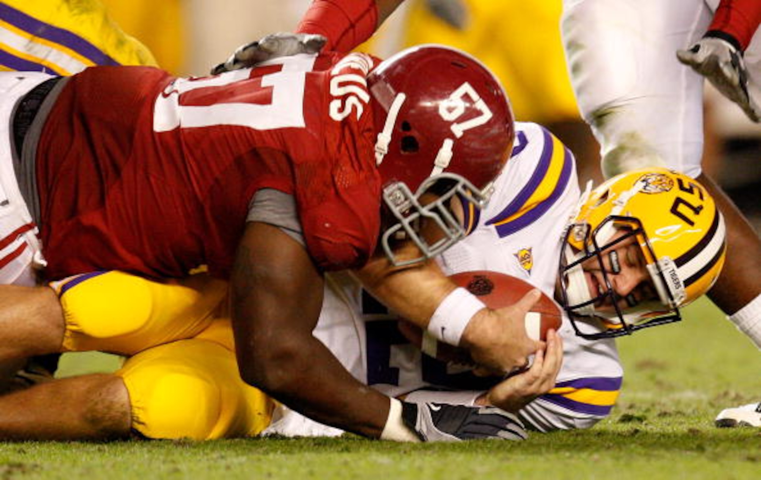 TUSCALOOSA, AL - NOVEMBER 07:  Marcell Dareus #57 of the Alabama Crimson Tide sacks quarterback Jarrett Lee #12 of the Louisiana State University Tigers at Bryant-Denny Stadium on November 7, 2009 in Tuscaloosa, Alabama.  (Photo by Kevin C. Cox/Getty Imag