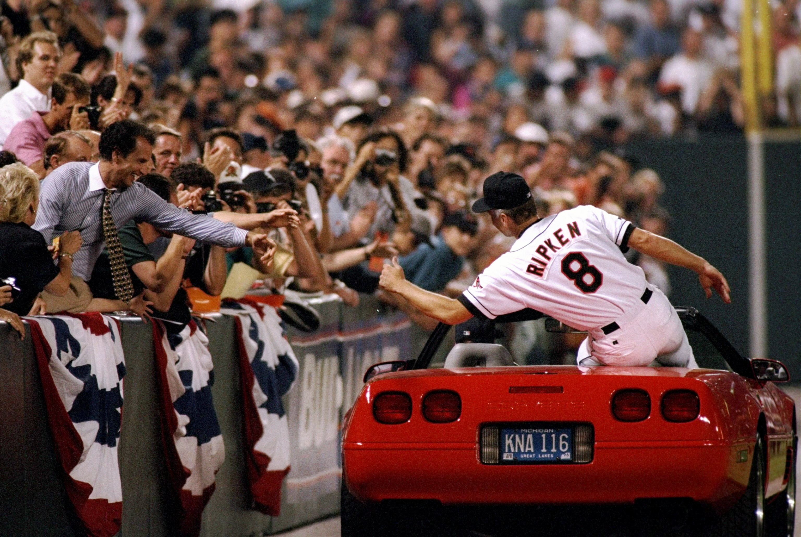 6 Sep 1995:  Shortstop Cal Ripken of the Baltimore Orioles shakes hands with fans at Camden Yards in Baltimore, Maryland to  acknowledge congratulations for breaking Lou Gehrig''s record for consecutive games played.  The game was against the California A